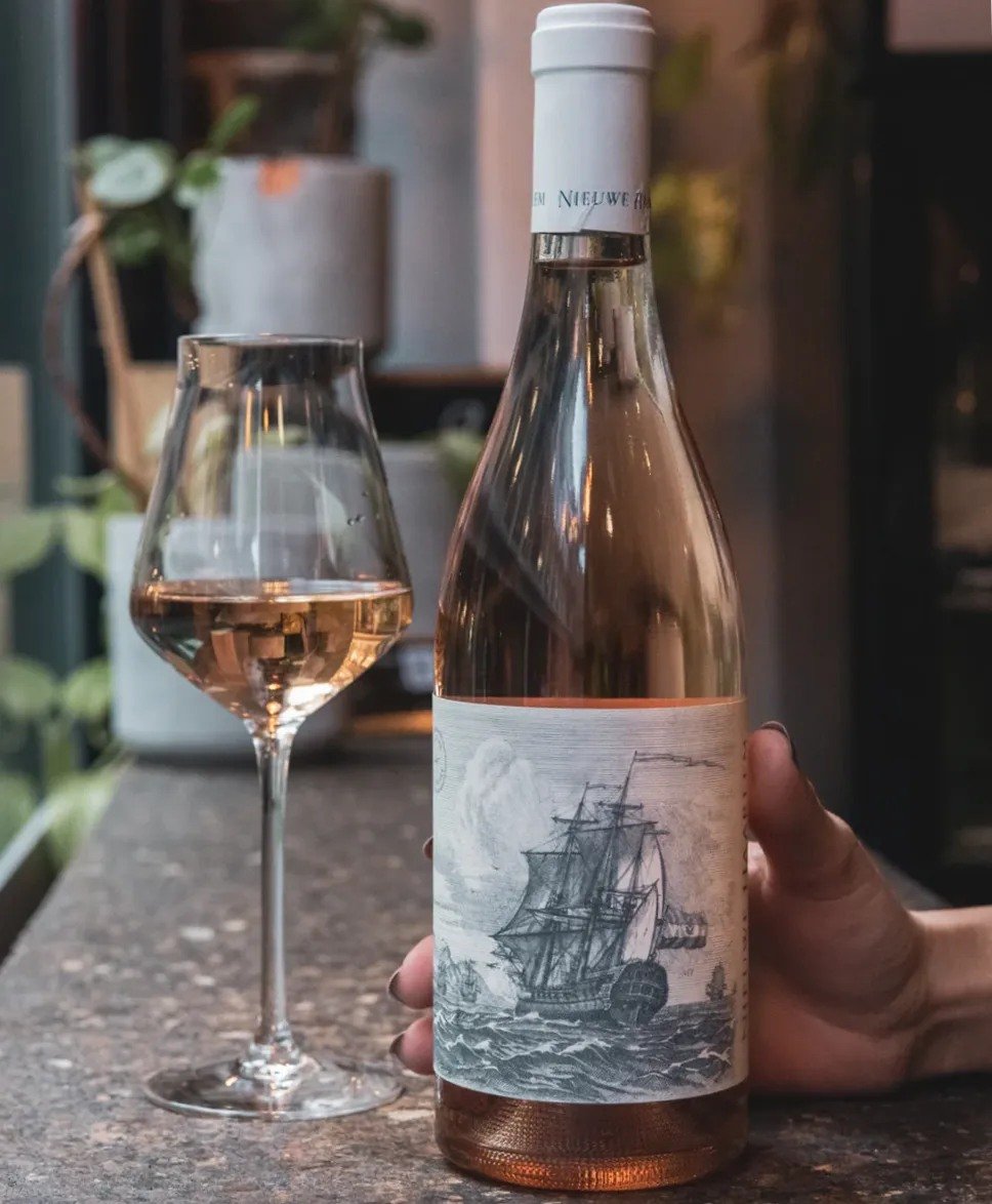 With a beautiful pale pink hue, Nieuwe Haarlem Ros&eacute; presents enticing aromas of ripe strawberries, watermelon, and hints of citrus, creating an inviting bouquet. On the palate, it is crisp and lively, offering a perfect balance of fruitiness a