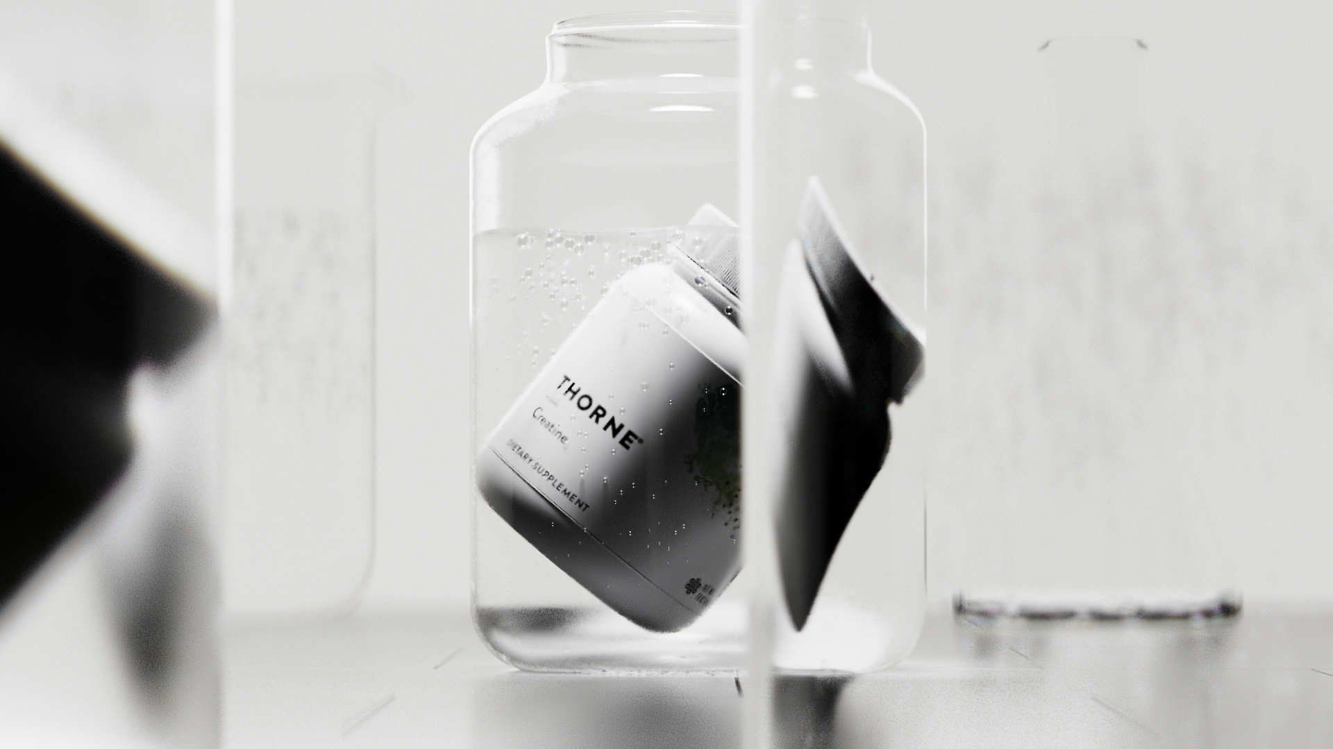 Thorne tub falling past lab glass, Thorne creatine CGI campaign by DissEmbargo