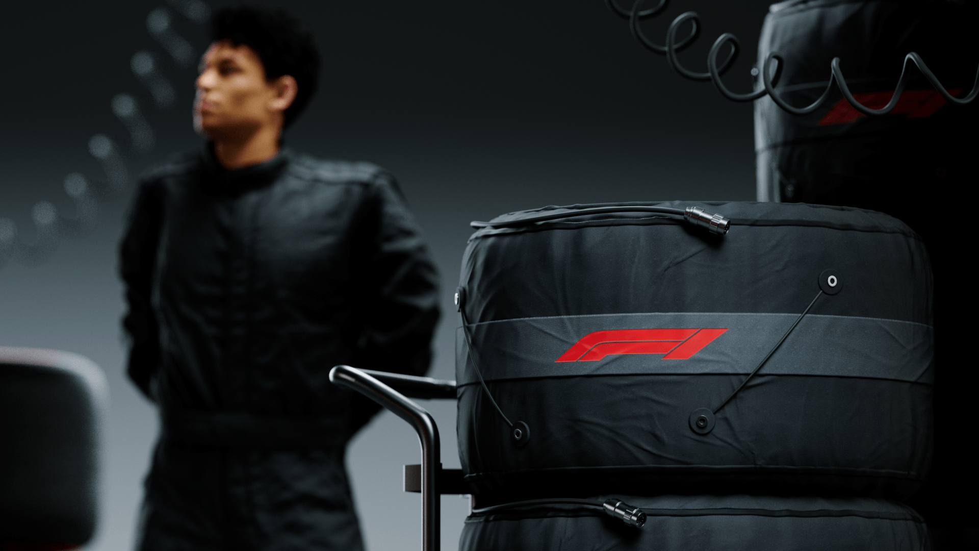 Driver beside a stack of tyres with F1 branding, Formula 1 2026 opening titles, 3D production by DissEmbargo