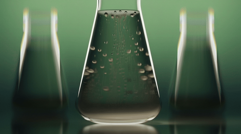 Lab flasks in green light, Thorne creatine CGI campaign by DissEmbargo