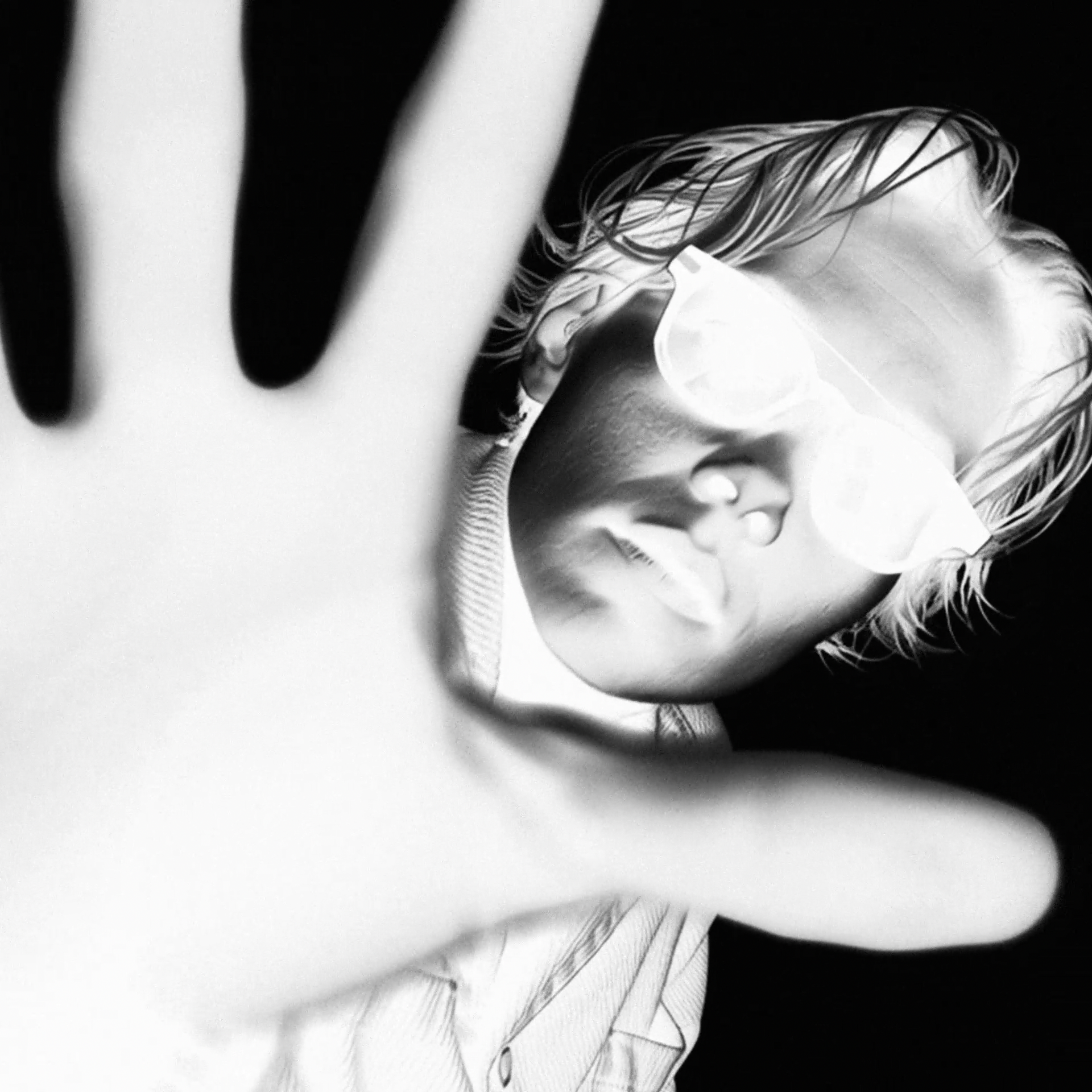 Hand reaching towards camera, campaign frame, Even Realities smart glasses CGI by DissEmbargo