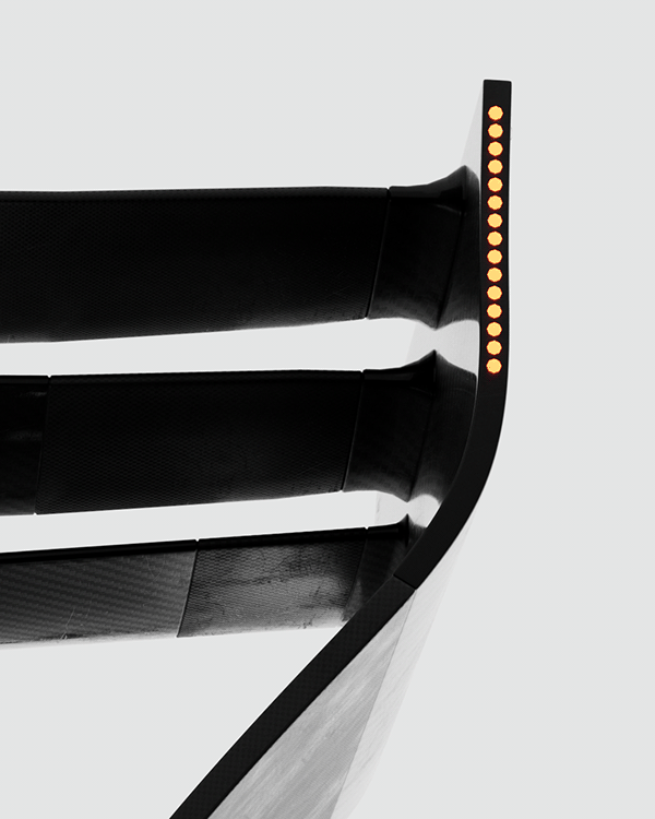 Close-up of an F1 wing endplate with amber lights, Formula 1 2026 opening titles, 3D production by DissEmbargo