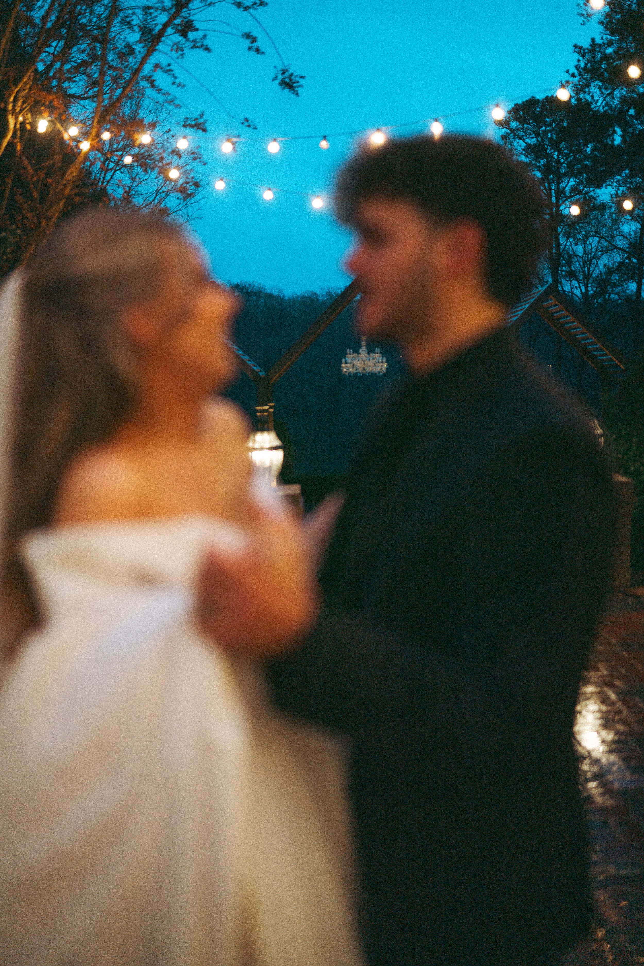  couples portrait session in the rain on their wedding day taken by NC’s best wedding photographer 