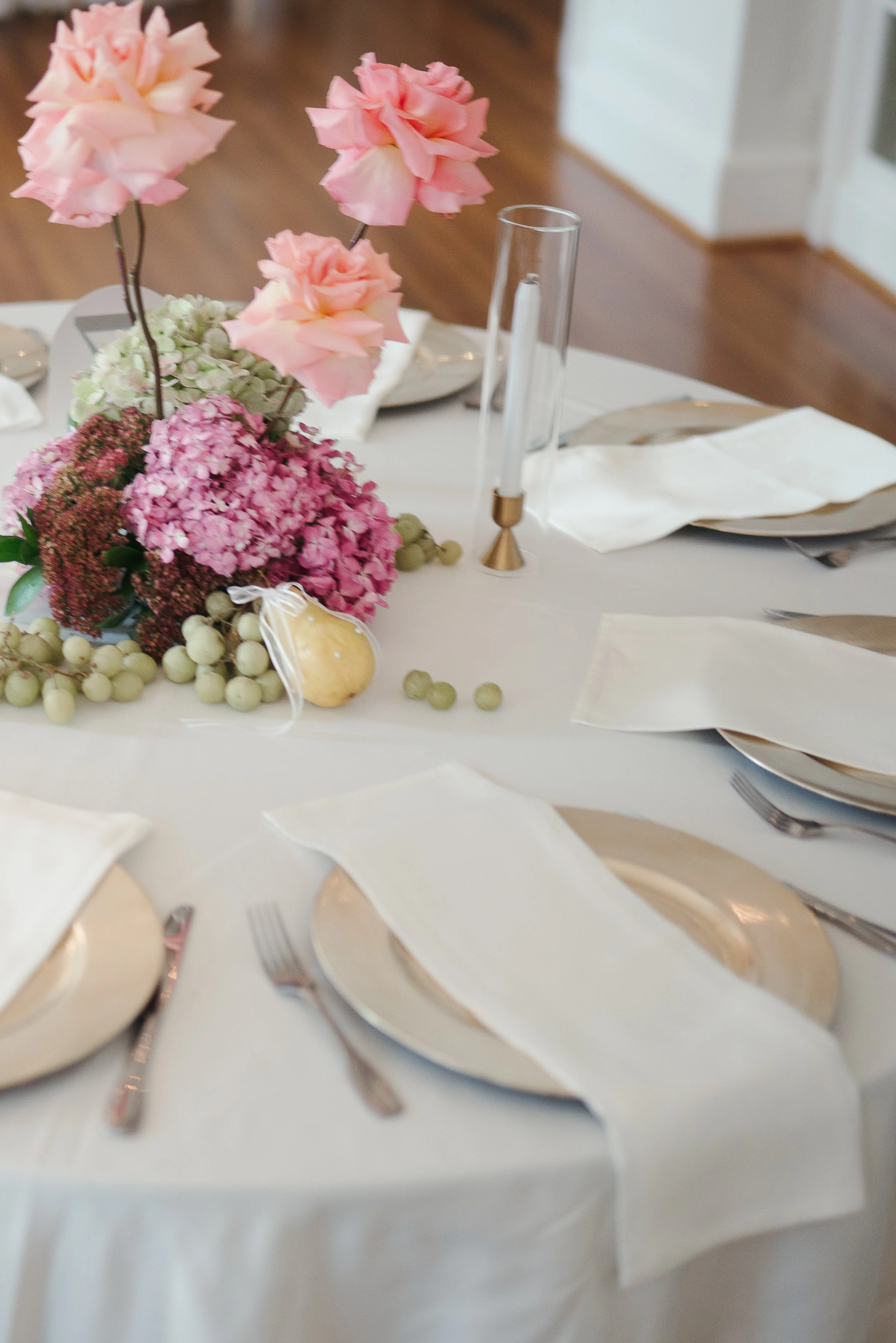 high end tablescape with florals and fruit
