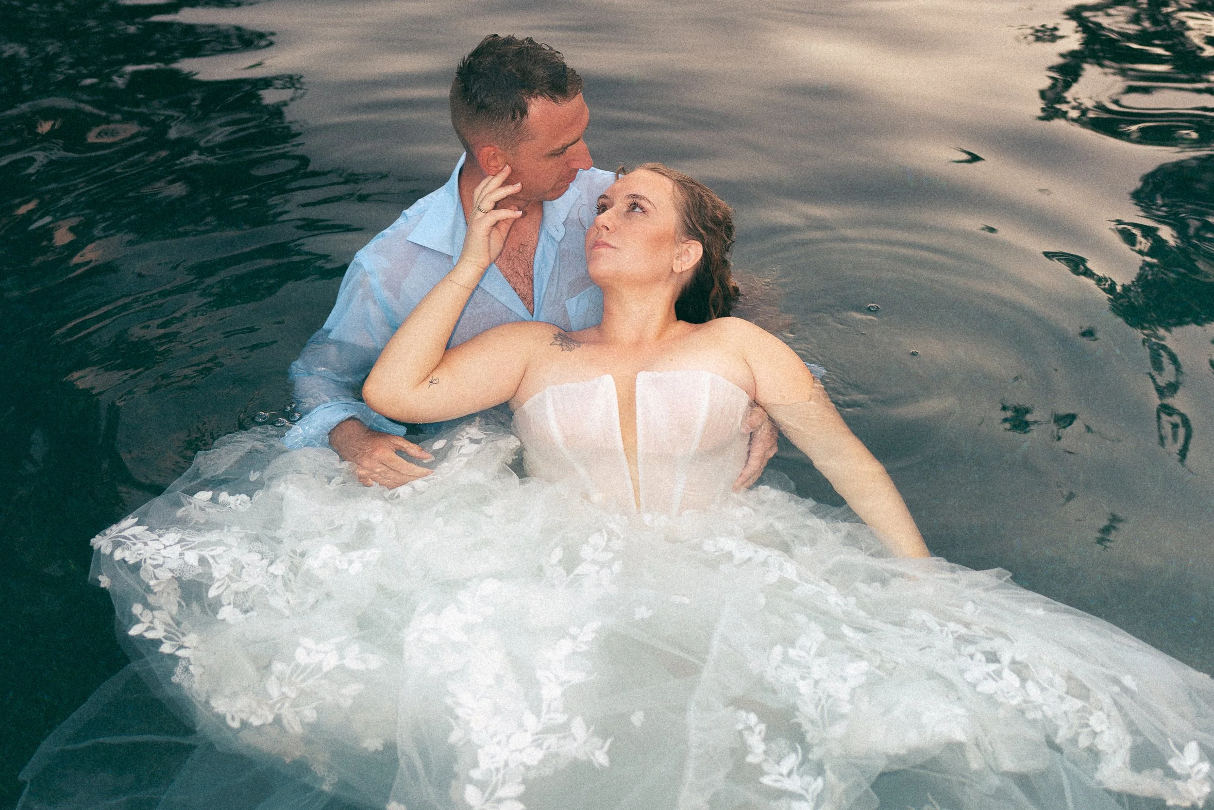 couple-in-pool-on-wedding-day