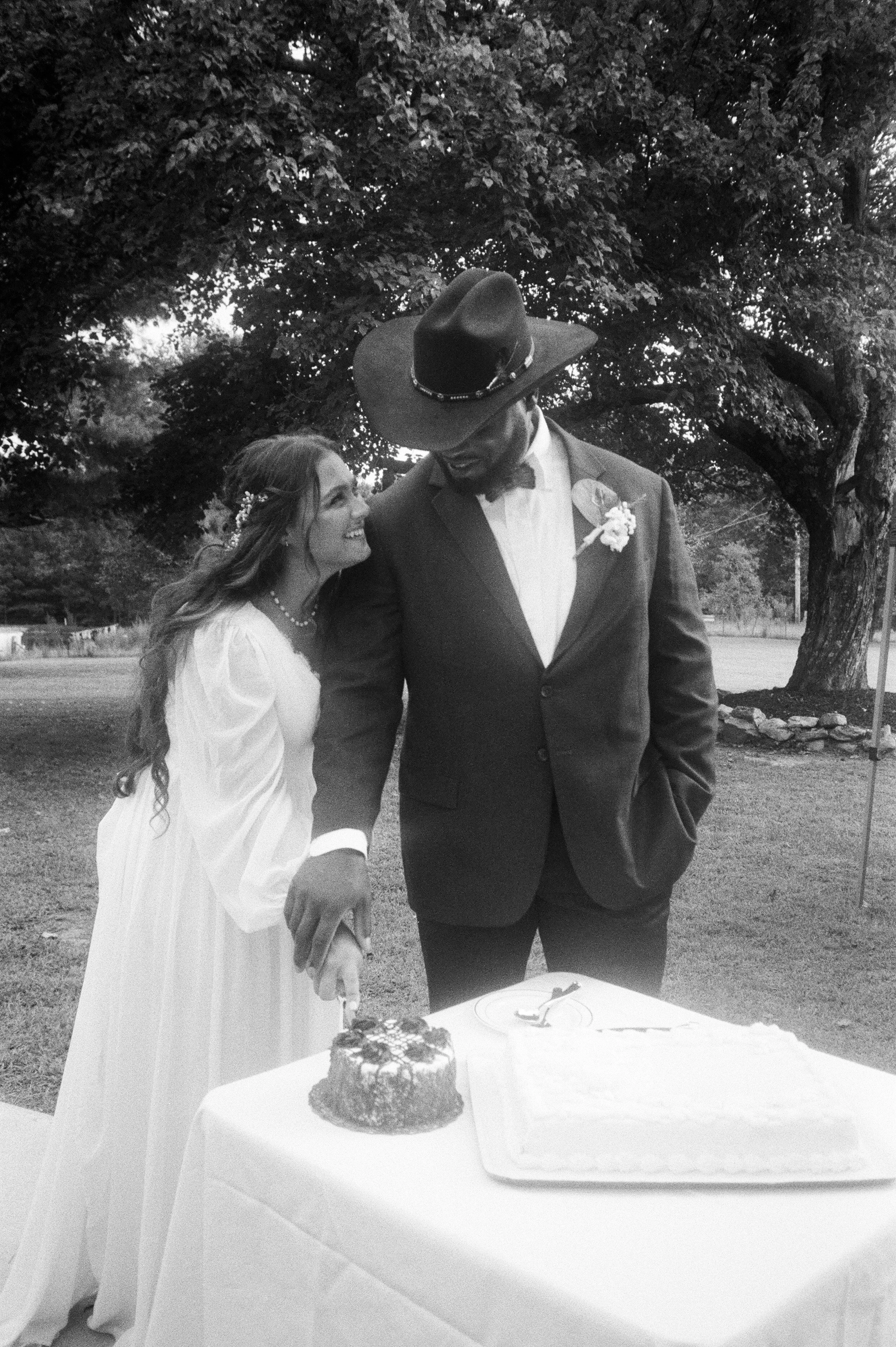 black and white film photo of real interracial couple on their wedding day in Lafayette, Georgia, photographed by Seagle Photography