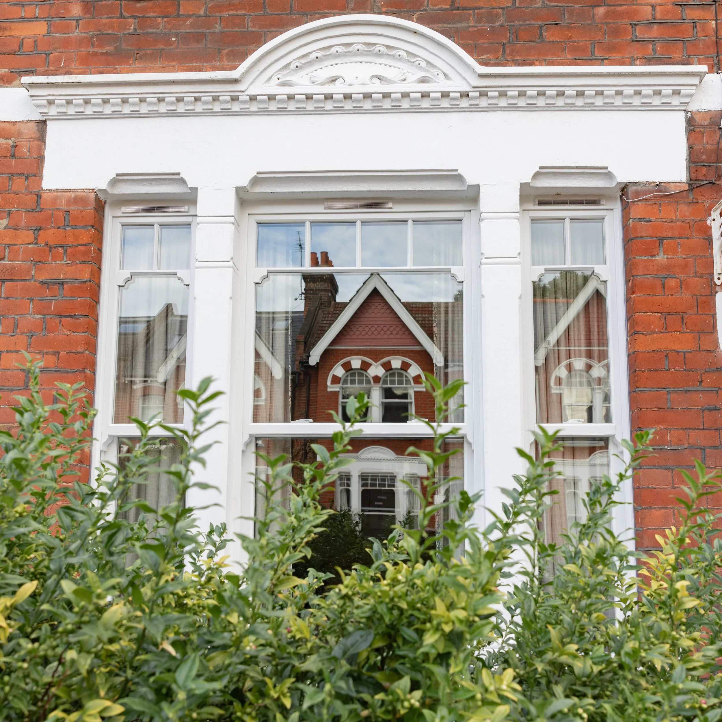 Bespoke Windows sash windows Edwardian house with window bars and triple pane