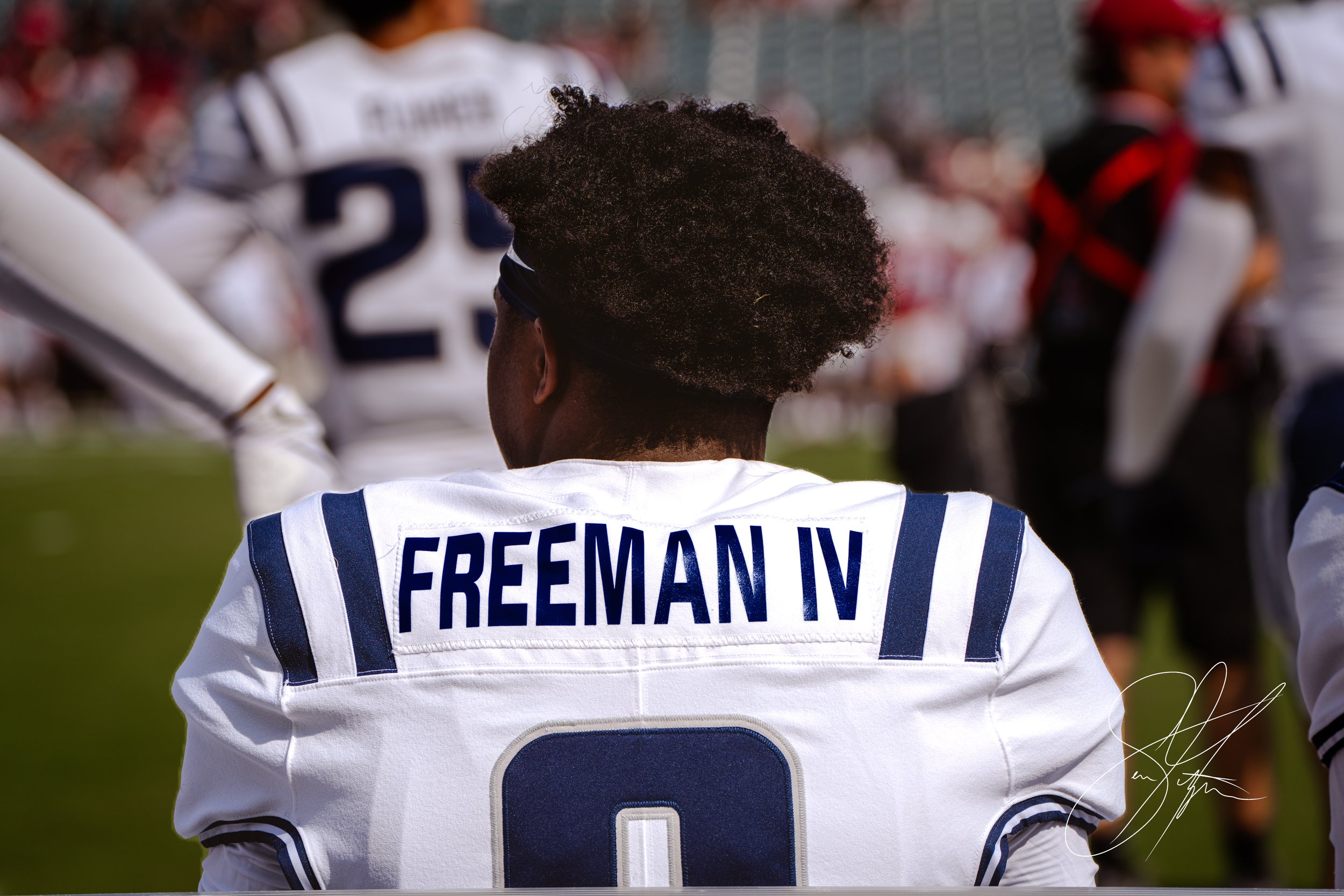 Football player wearing jersey with name 'Freeman IV' and number 0.