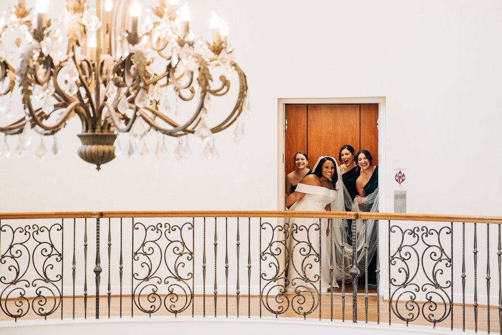 037-bride bridesmaids in elevator.jpg