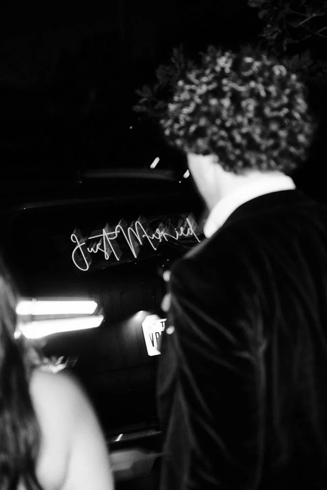 172-wedding exit rose petals getaway car.jpg