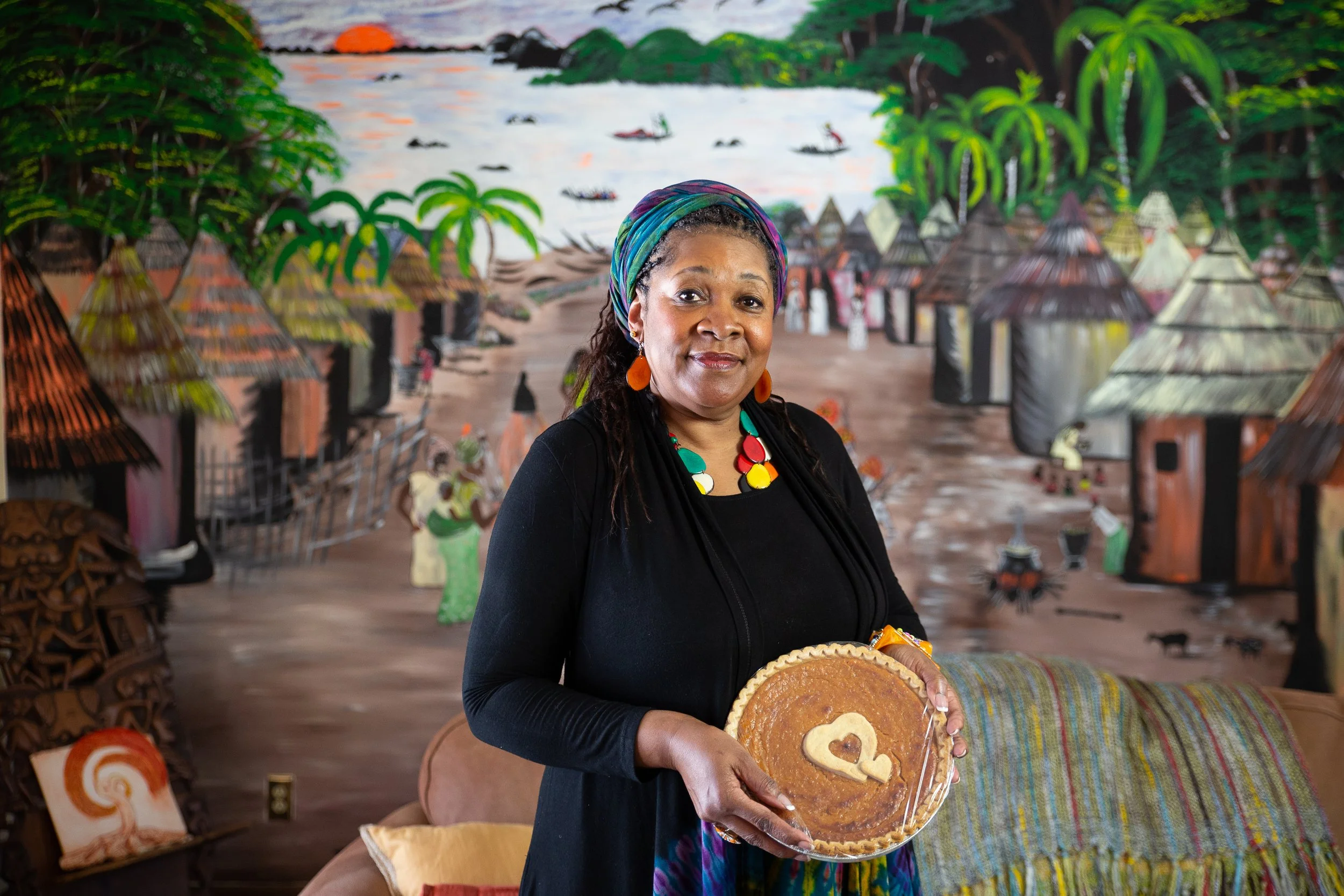 Portrait of African American woman holding pie