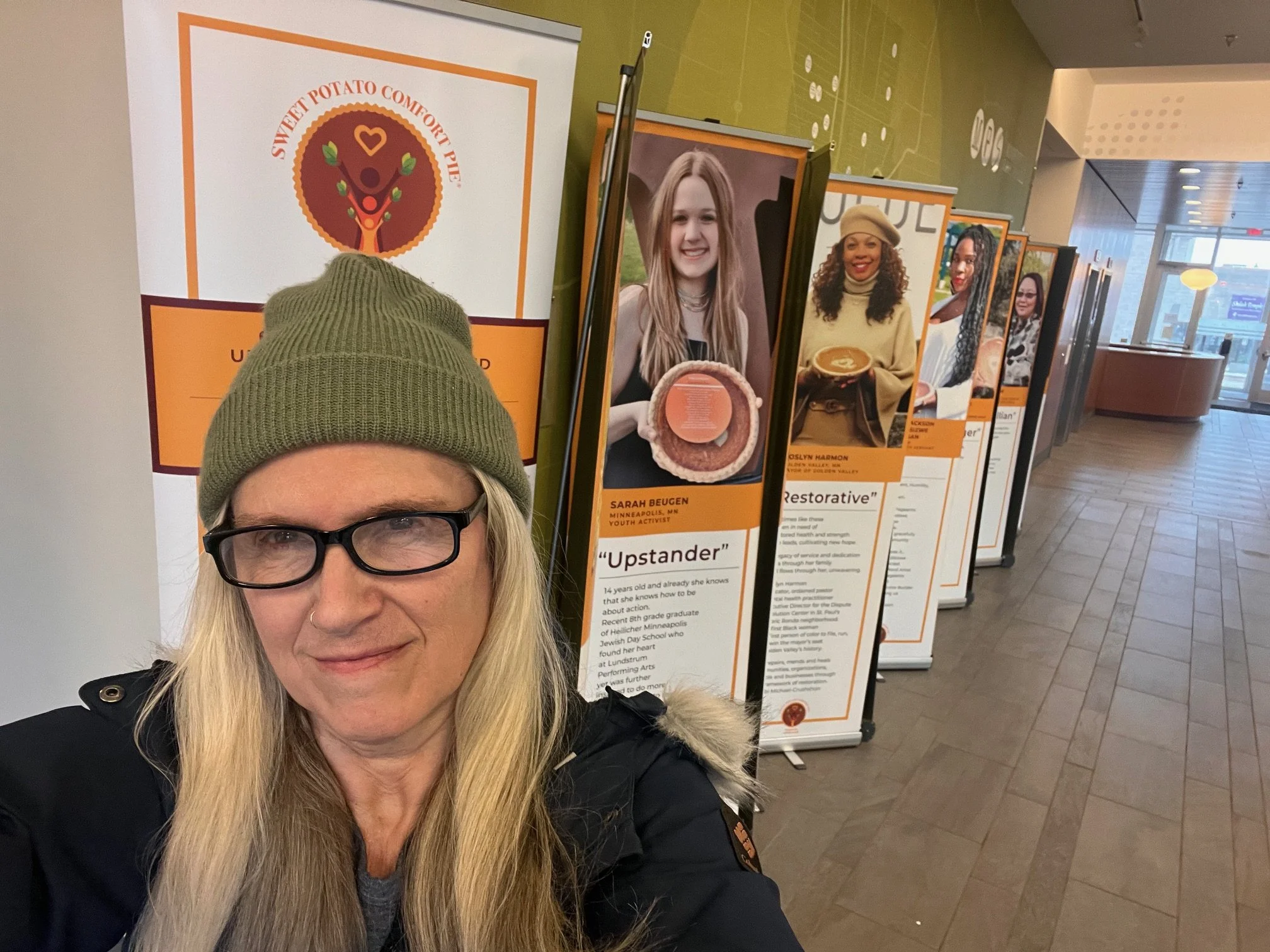 Selfie of woman in front of exhibit
