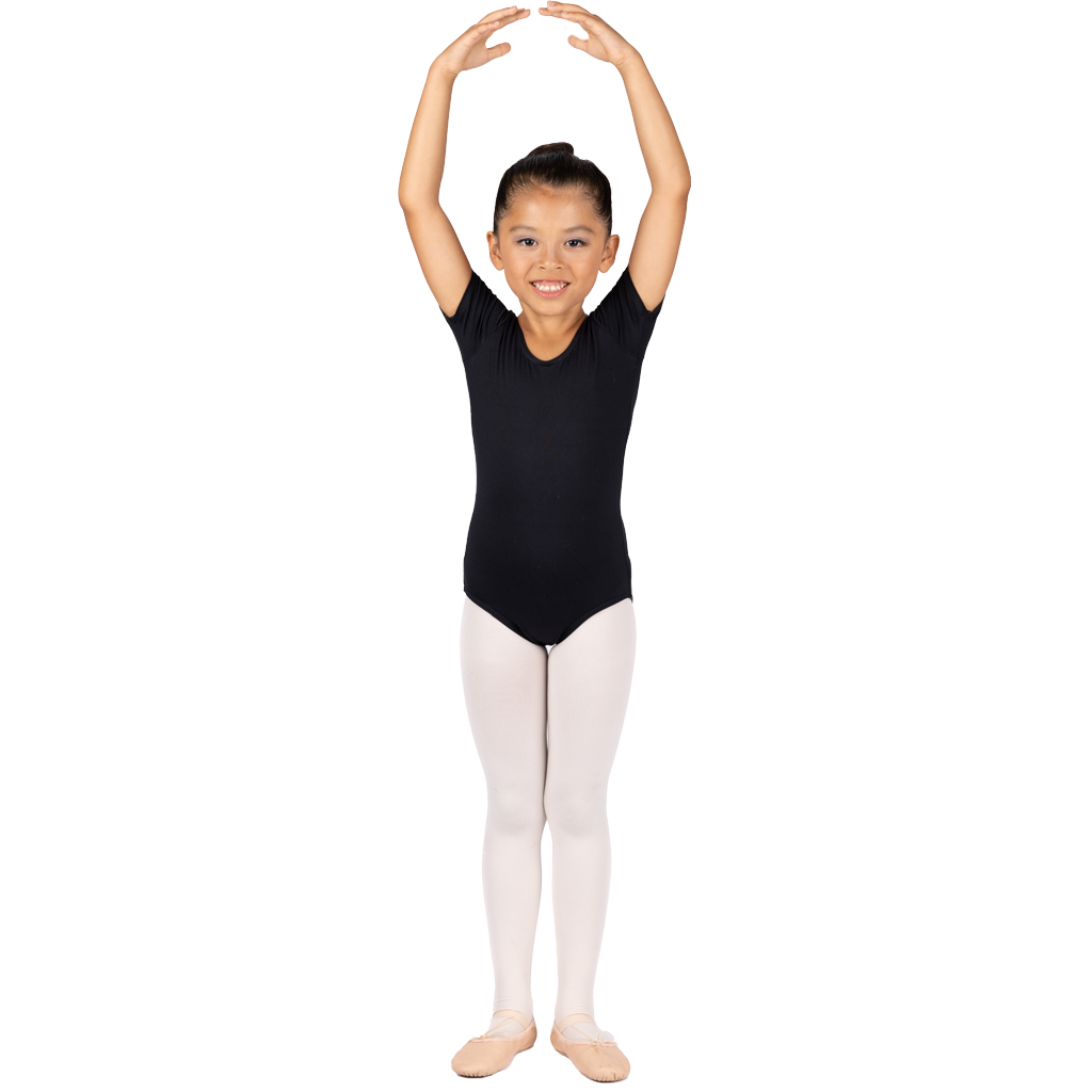 Young girl in black leotard and white tights standing with arms raised above her head in a ballet pose.