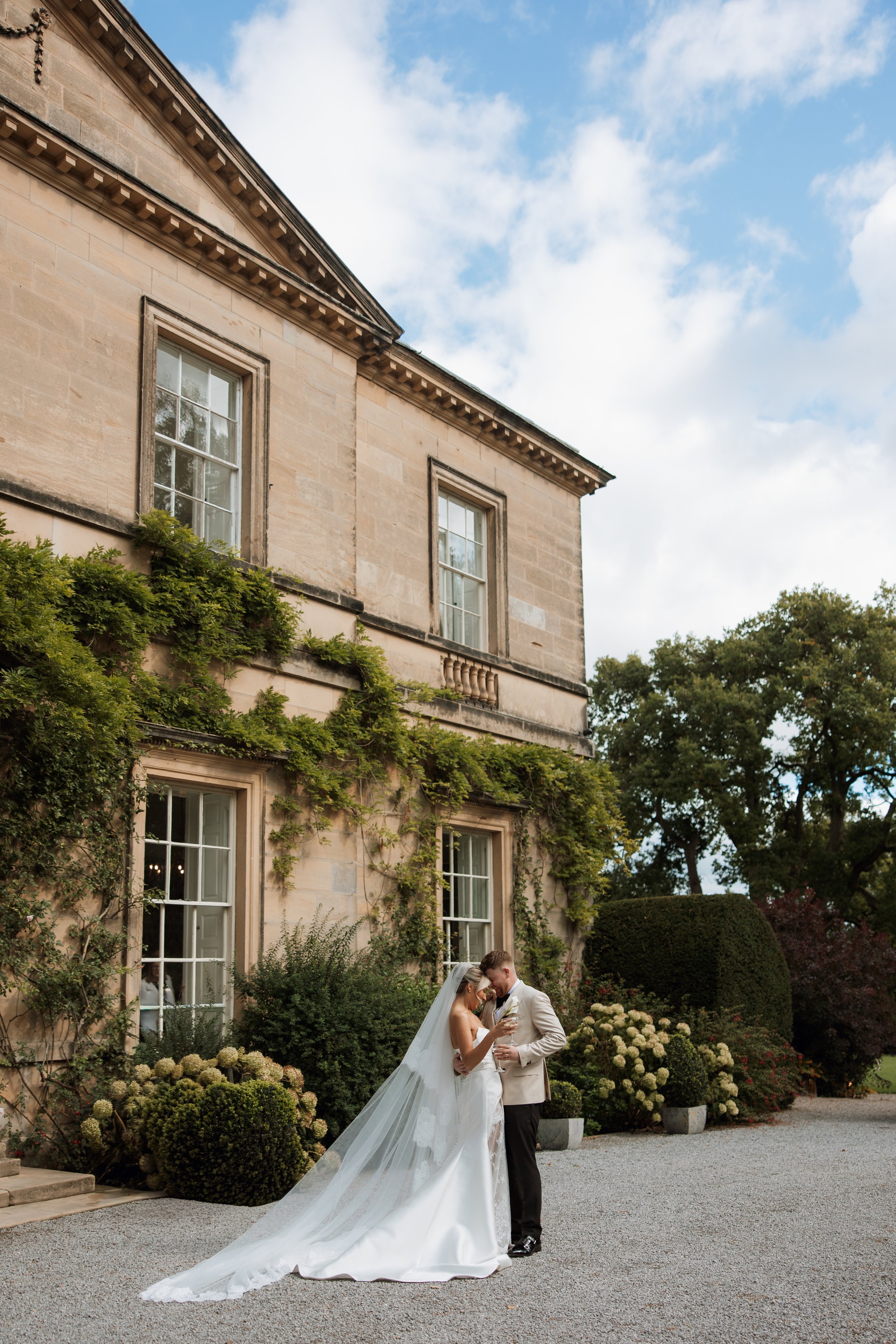 Bride and groom having intimate natural moment at Middleton Lodge gardens in autumn, North Yorkshire wedding photography
