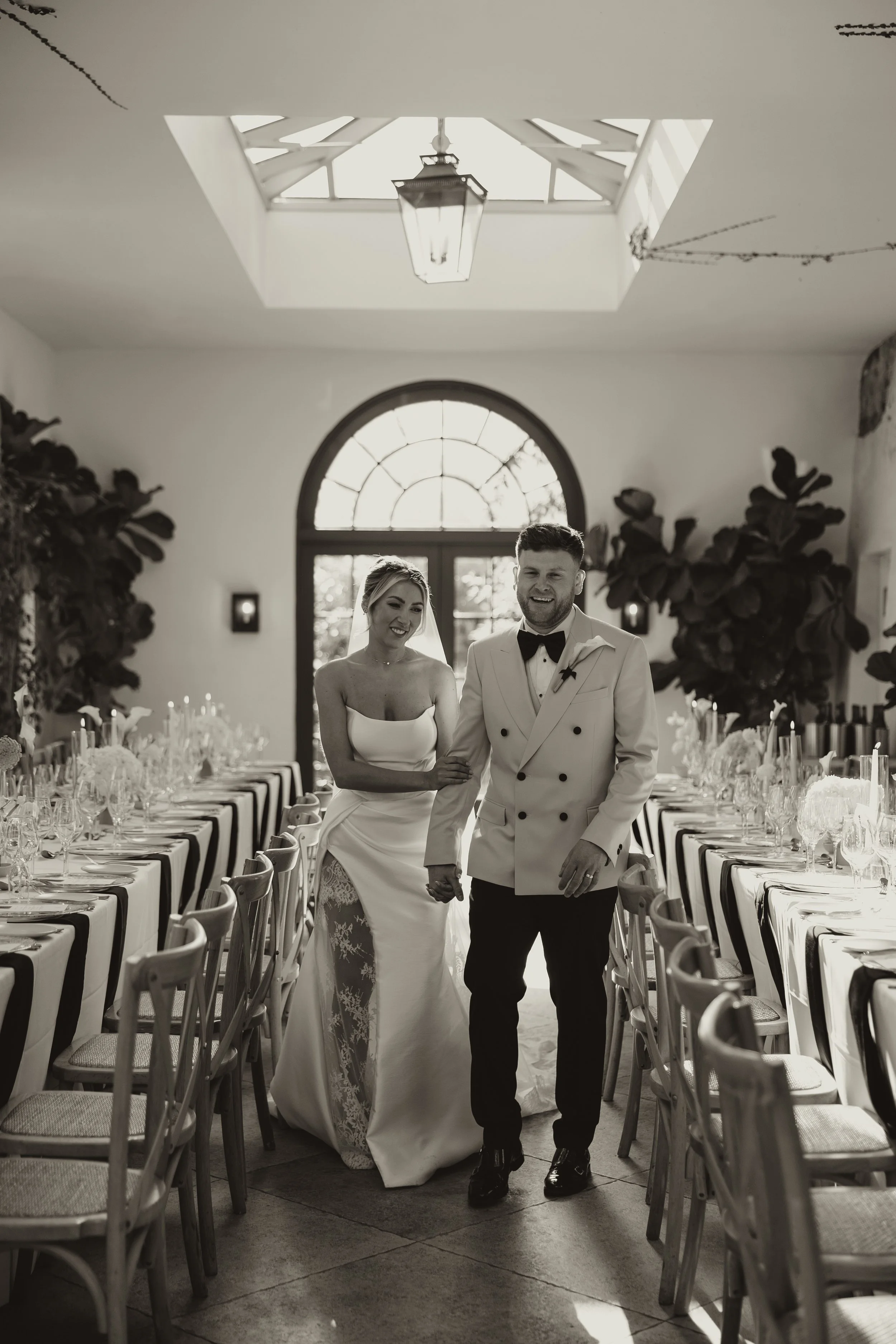 Relaxed candid wedding moment between bride and groom in Fig House at Middleton Lodge captured in a natural editorial style