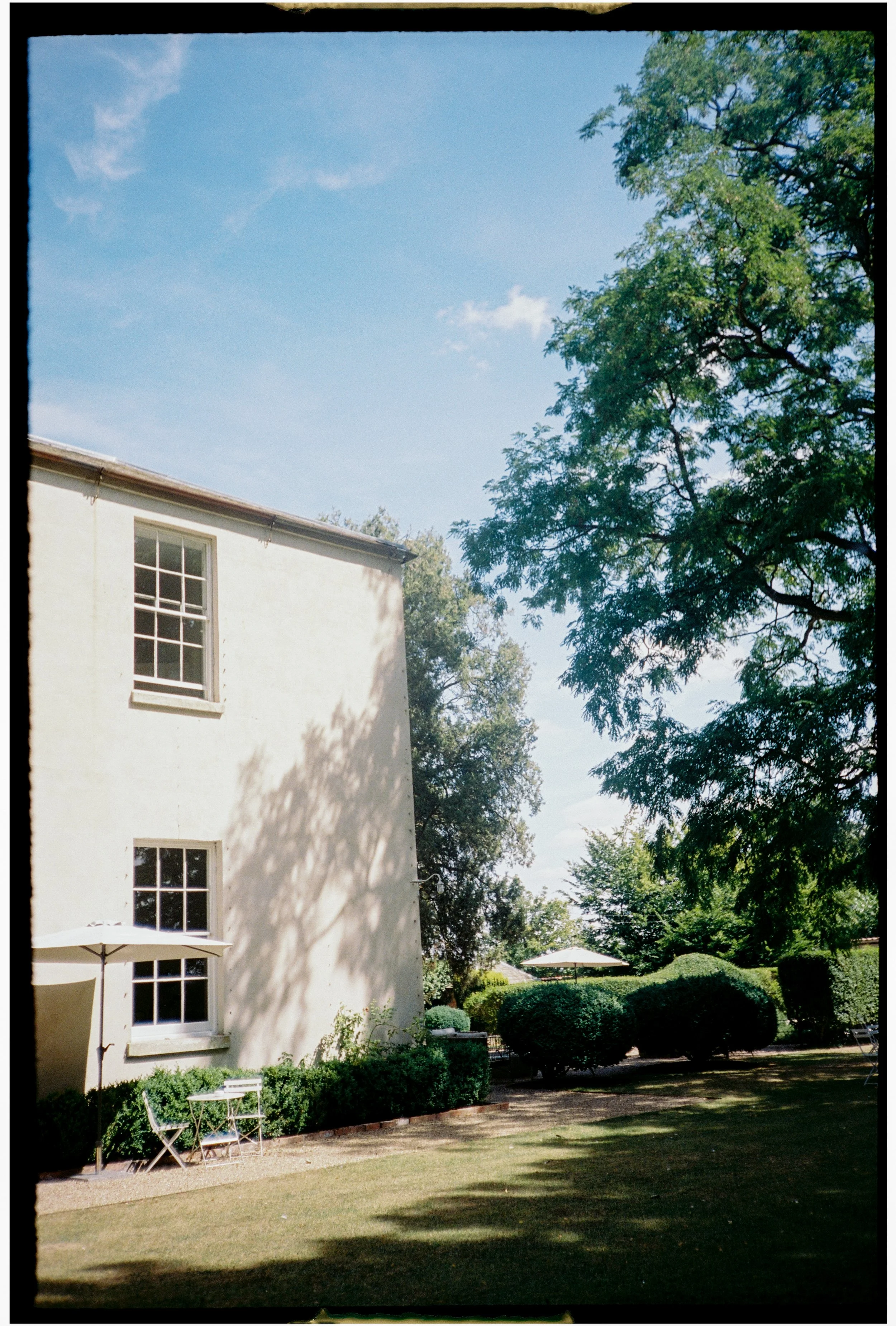  Aswarby Rectory in Lincolnshire captured on film with soft light, subtle grain, and a nostalgic aesthetic 