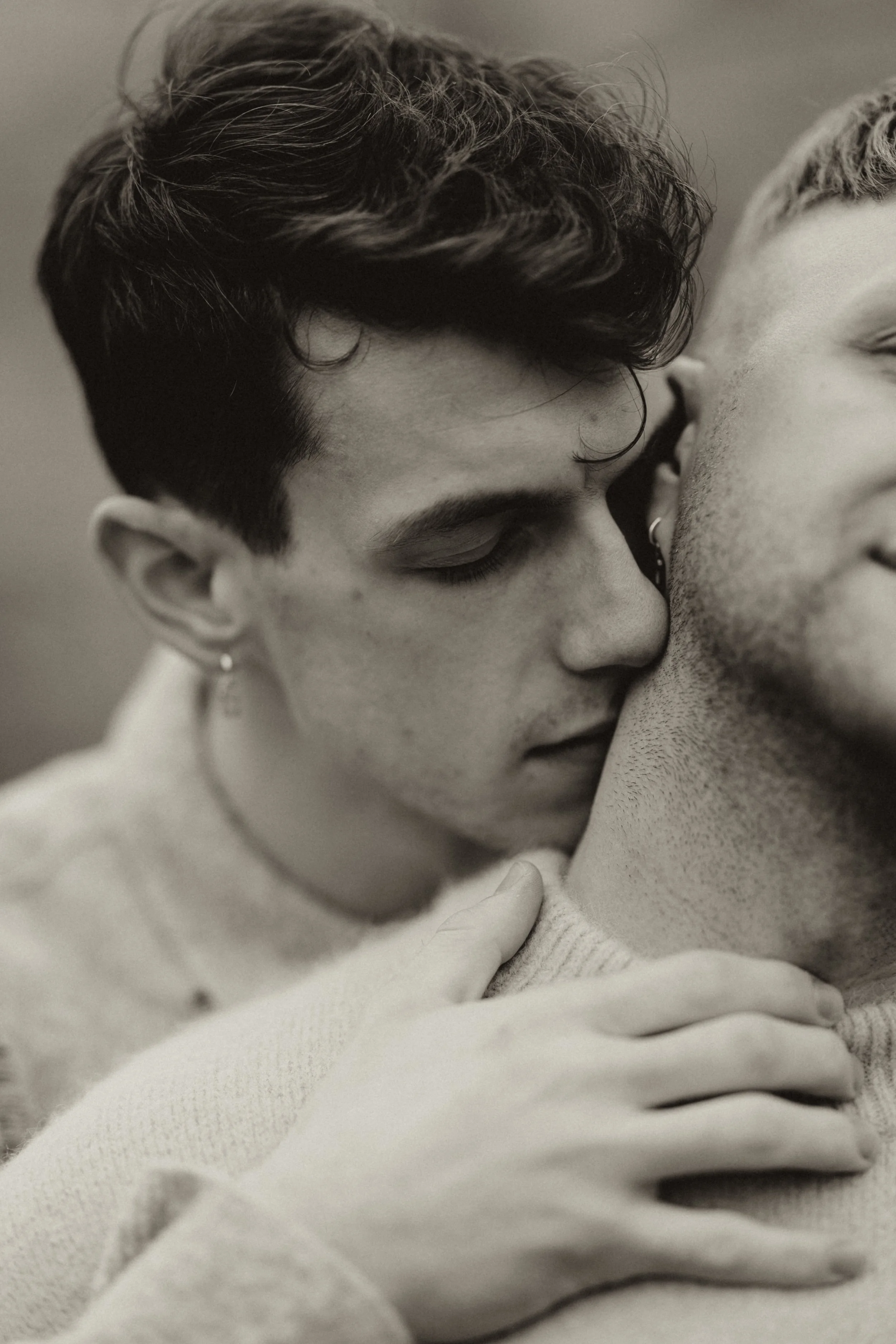 Fashion-inspired close up portrait of a stylish same sex gay male couple in an editorial setting taken during a engagement photoshoot