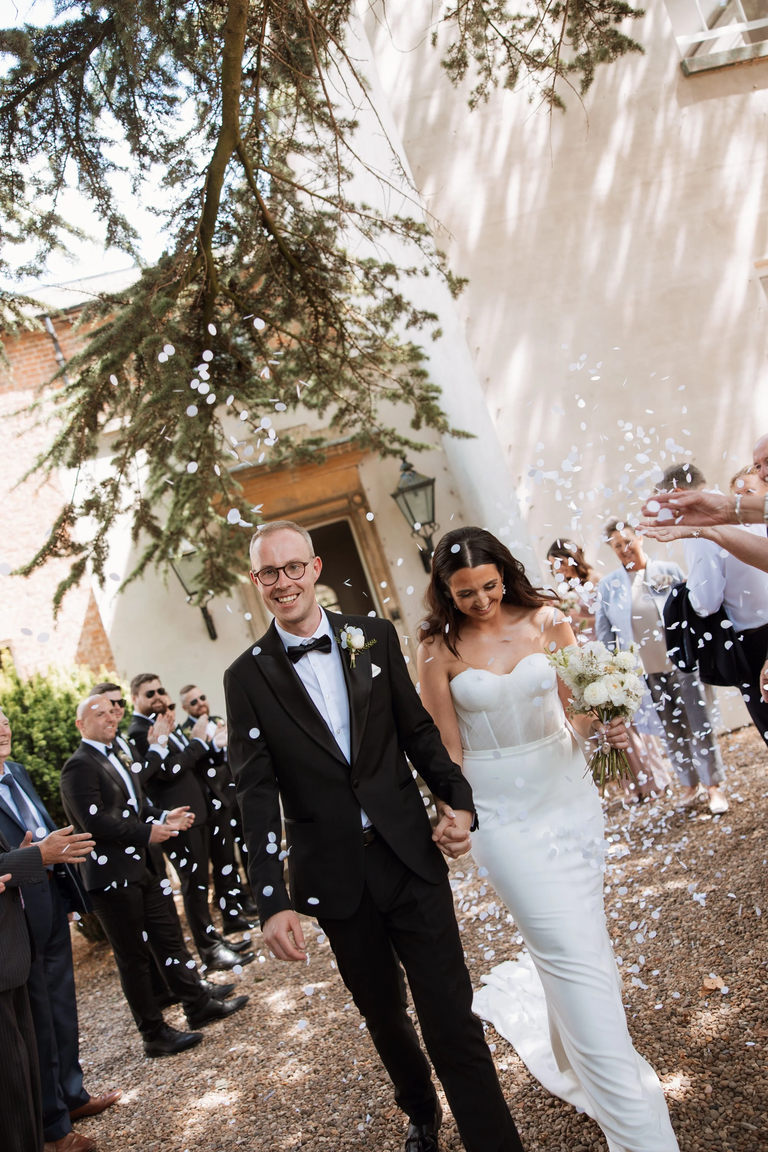 Confetti throw at black tie wedding at Aswarby Rectory
