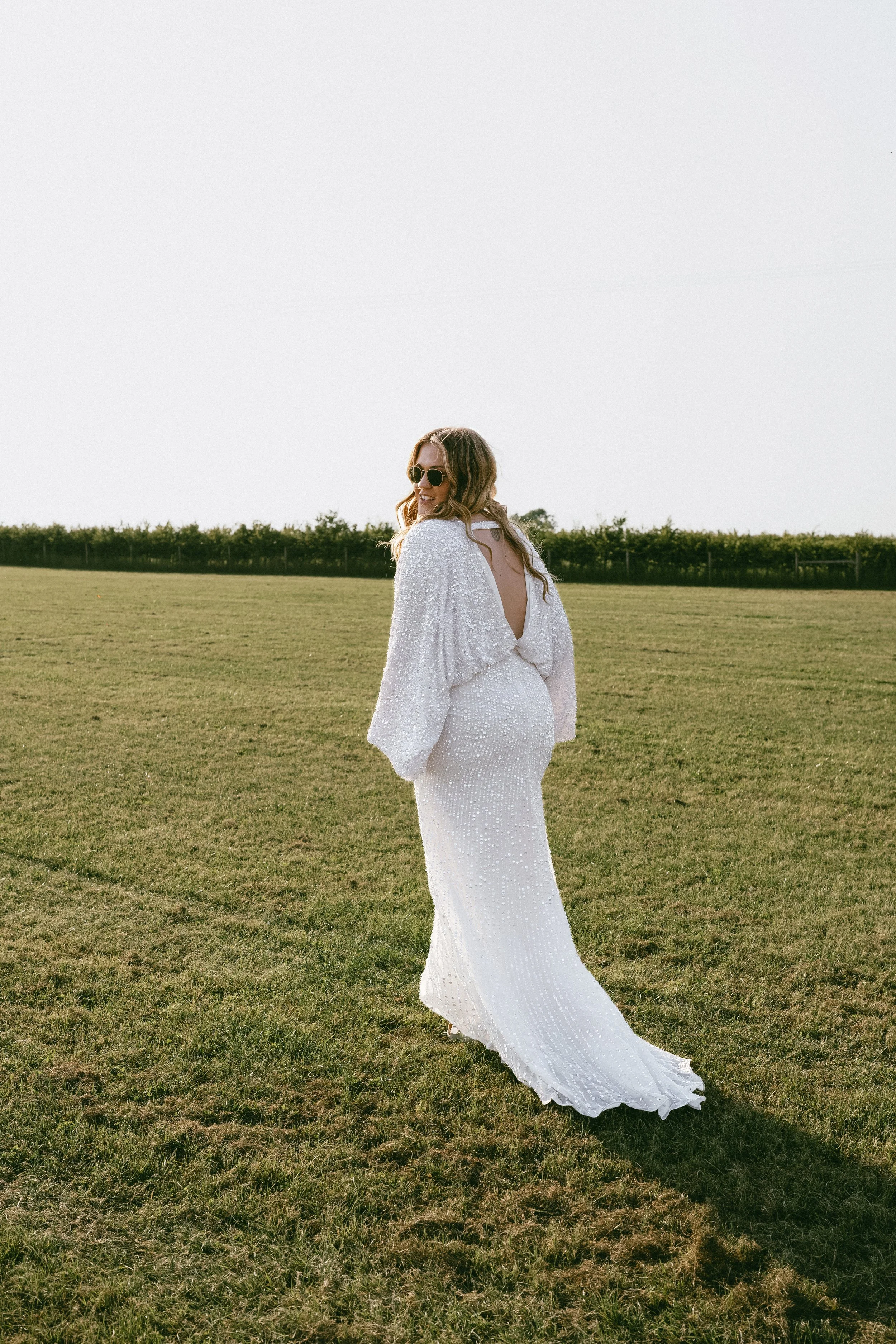Natural, unposed image of me in my wedding dress on my wedding day