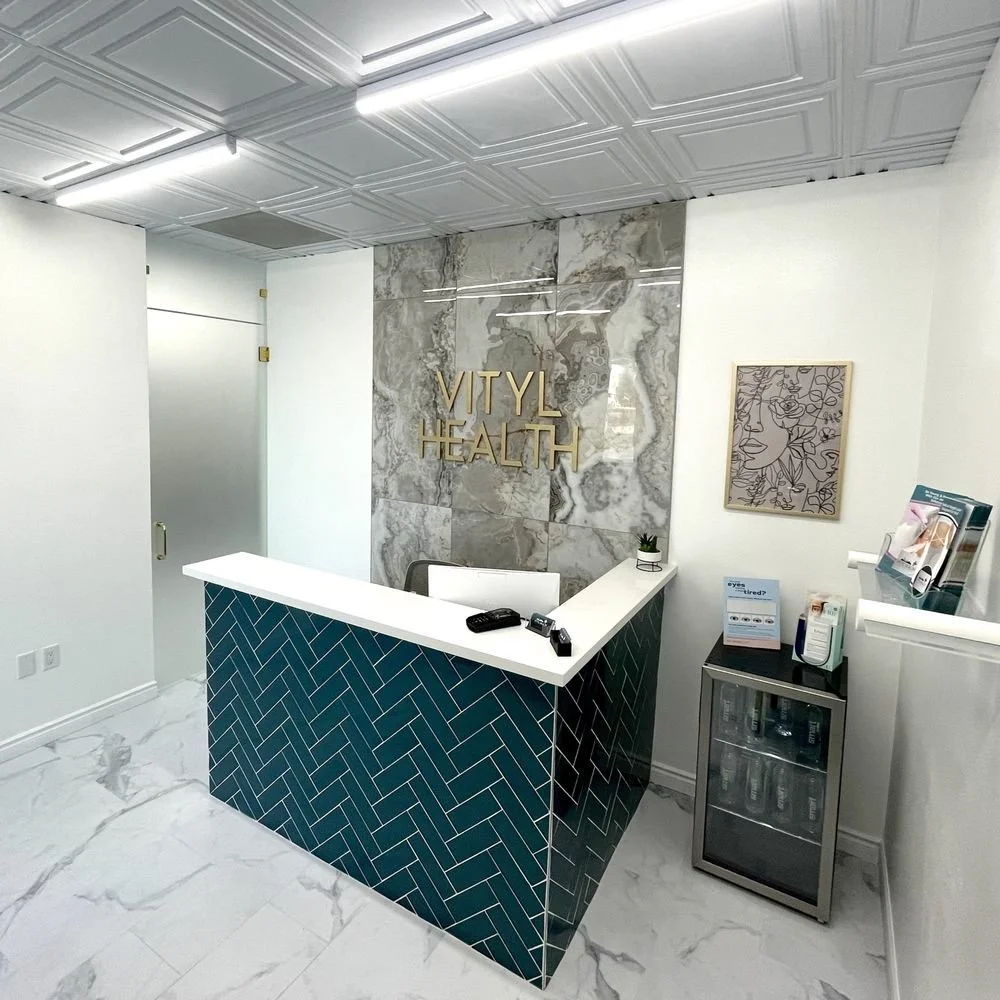Clean, professional medical spa treatment room with neutral tones at Vityl Health in Henderson