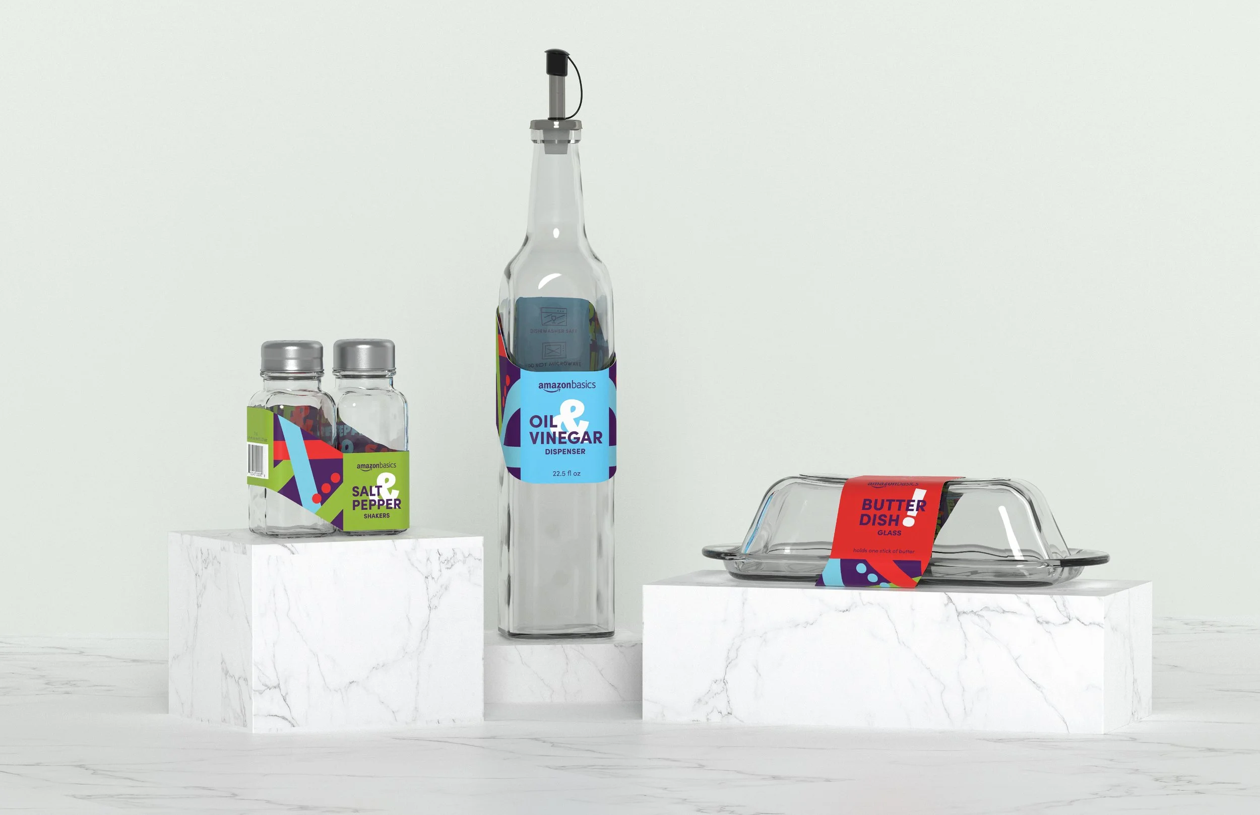 Three glass products— oil dispenser, salt & pepper shakers, and a butter dish