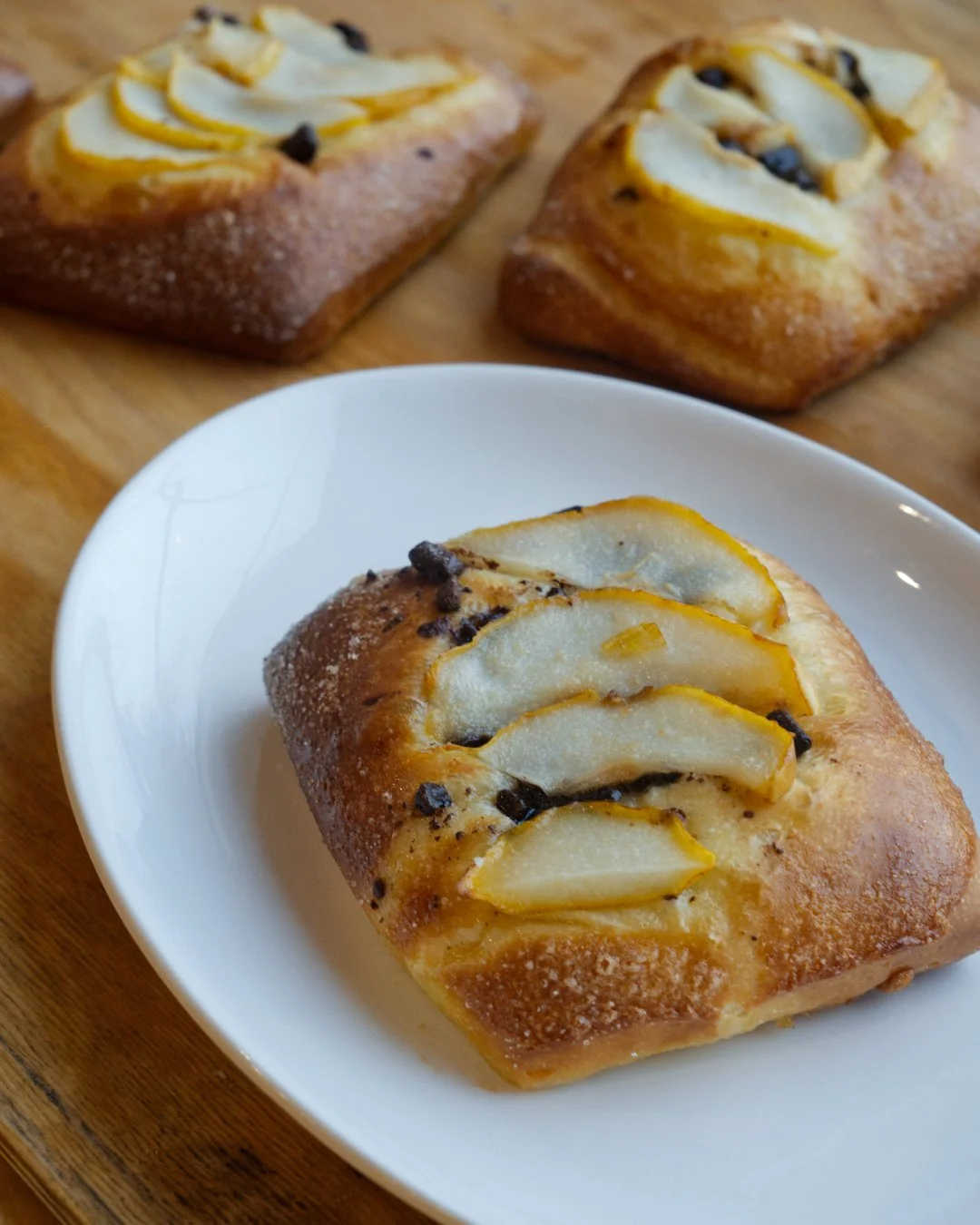Soft brioche, sliced pear, and little bits of chocolate on top

It&rsquo;s a pastry for people who say they don&rsquo;t have a sweet tooth, try it with our