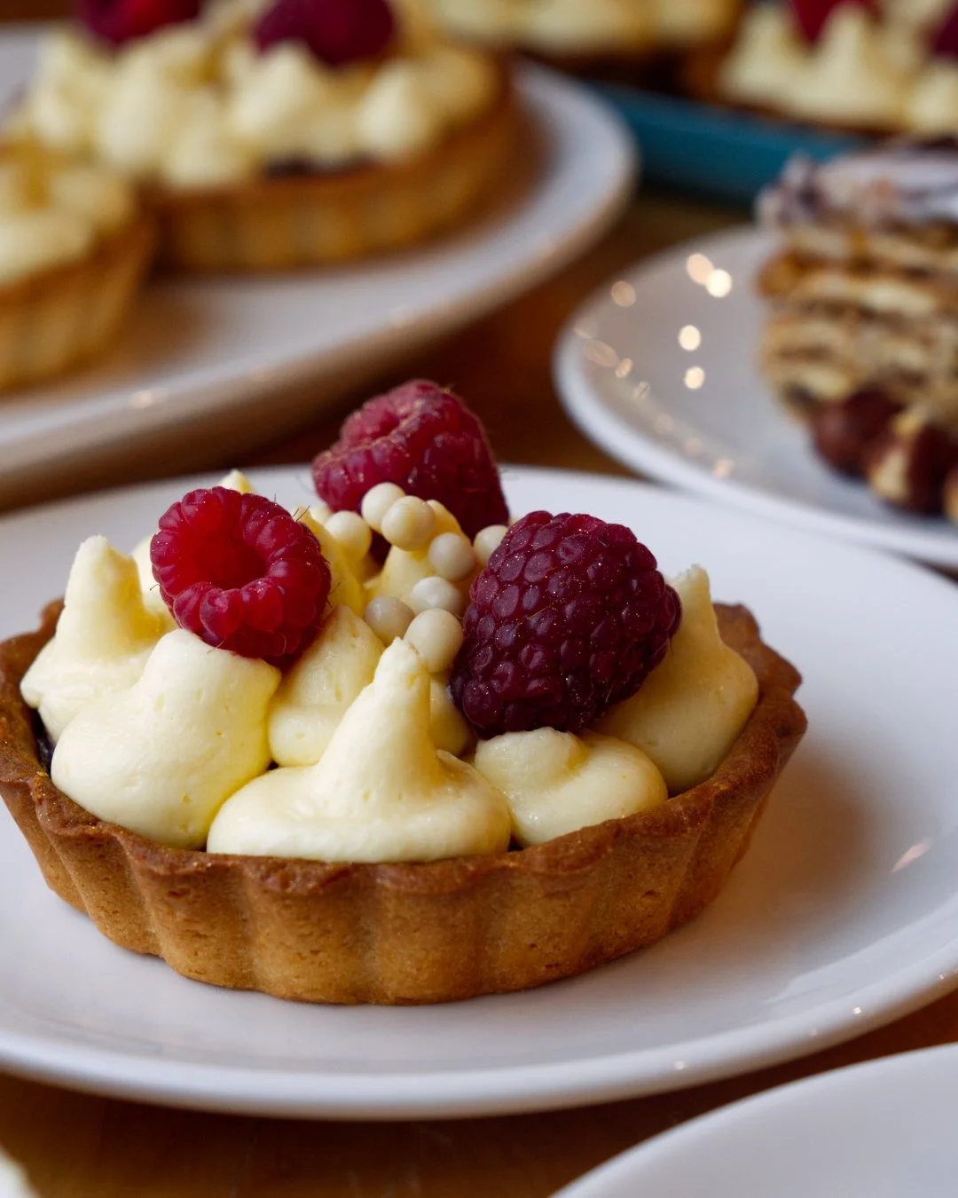 Okay, this one&rsquo;s a looker! 

Cherry custard tart, now in the pastry case, crisp shell, big swirl of custard, fresh raspberries on top, we keep walking past it just to look hahaha