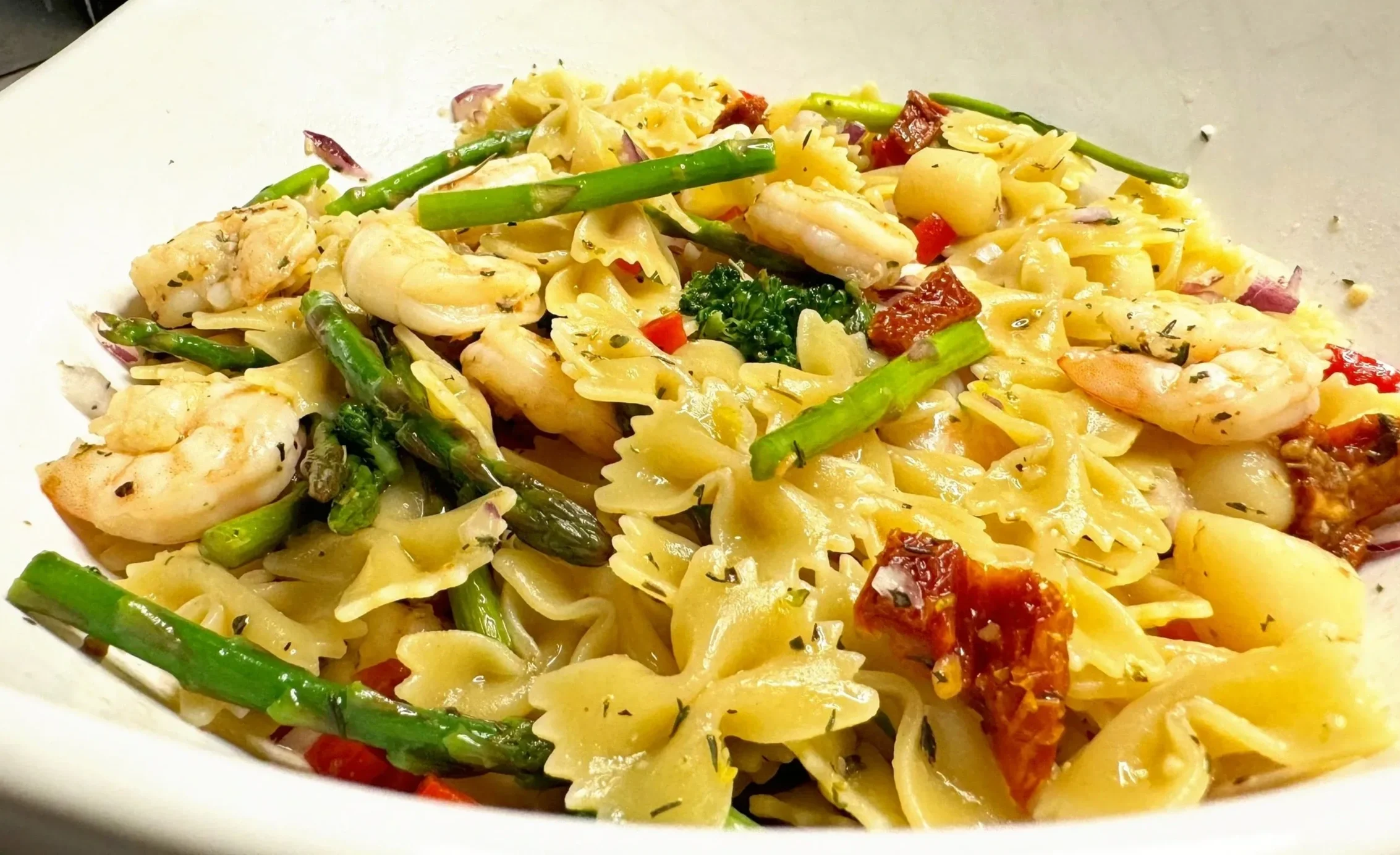 Seafood pasta salad with shrimp, asparagus, and lemon garlic vinaigrette