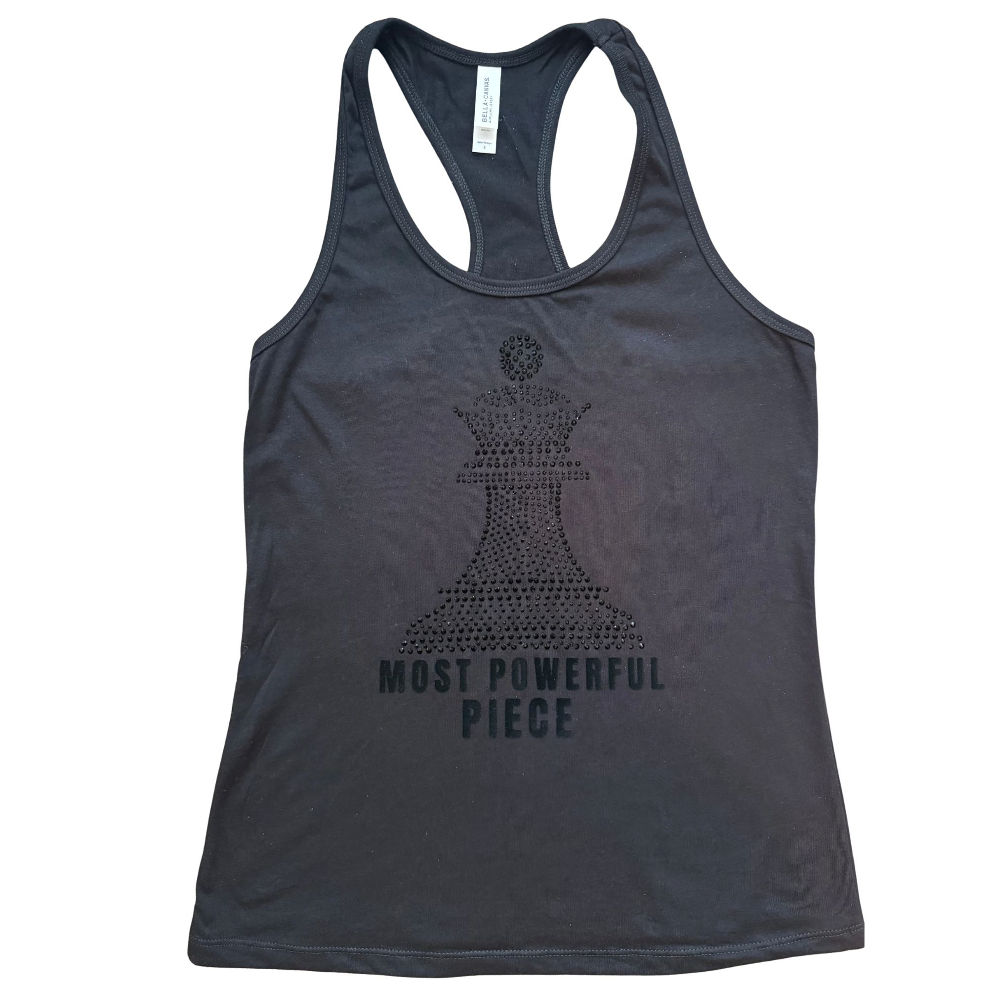 Women's black racerback tank featuring a black rhinestone Black Queen chess piece design with the words "Most Powerful Piece" in black lettering for a sleek monochromatic look.