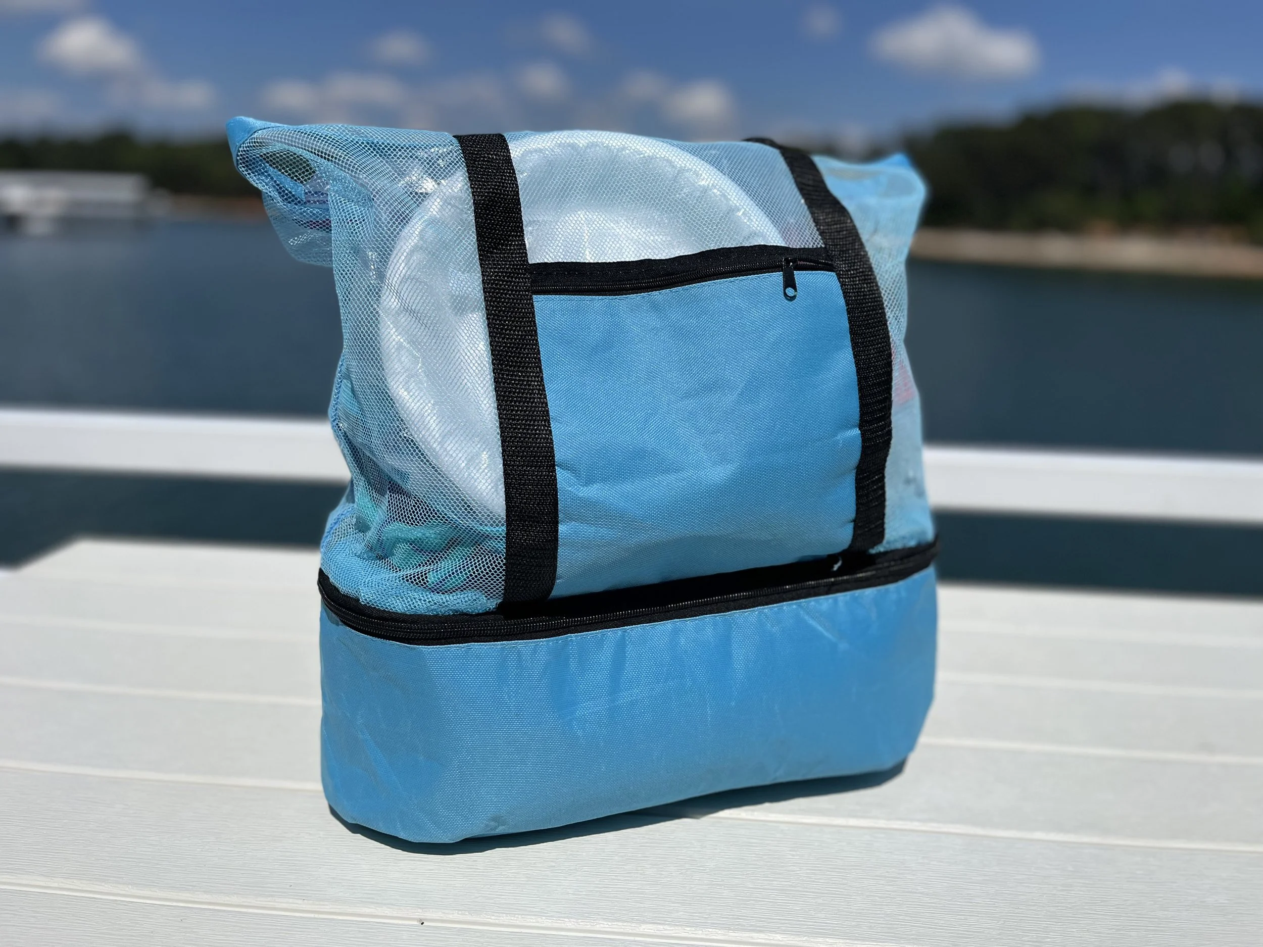 Blue mesh beach tote bag with separate bottom food compartment for snacks and drinks, ideal for lake trips, boating, beach days, and travel.