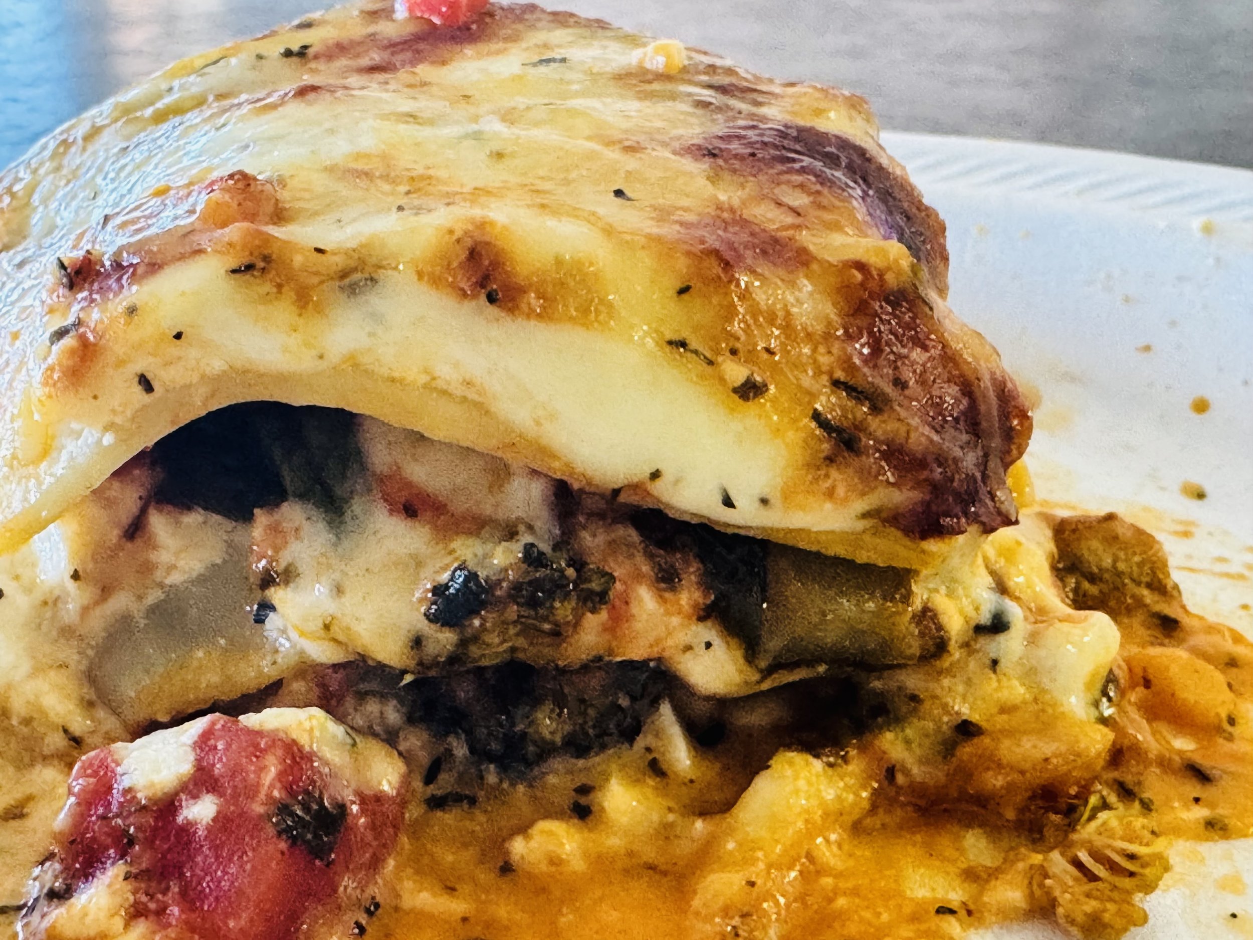 Roasted squash, zucchini, mushrooms, tomatoes, spinach, and broccoli lasagna