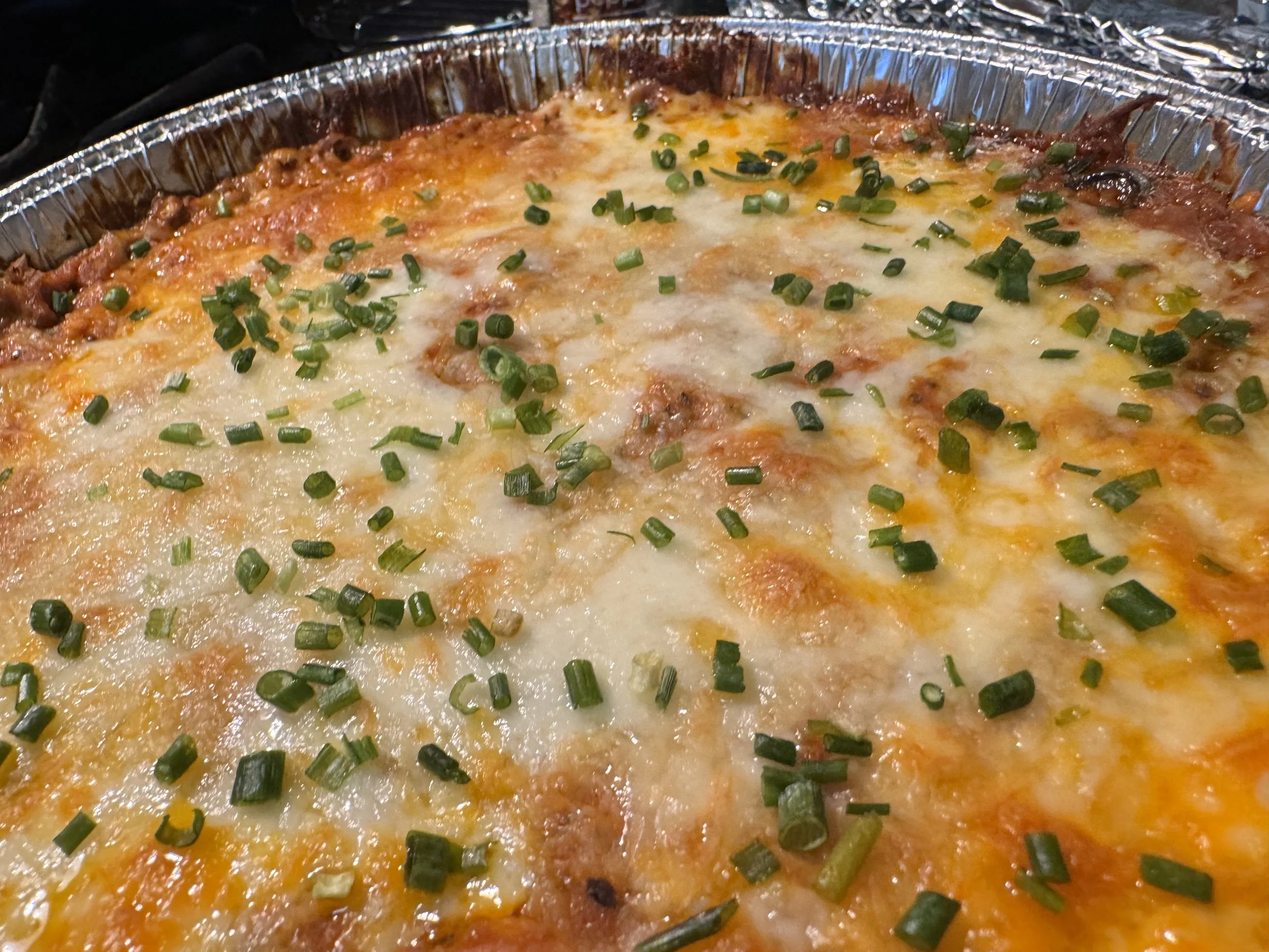 Cheesy baked pizza dip loaded with favorite pizza toppings and Italian flavors