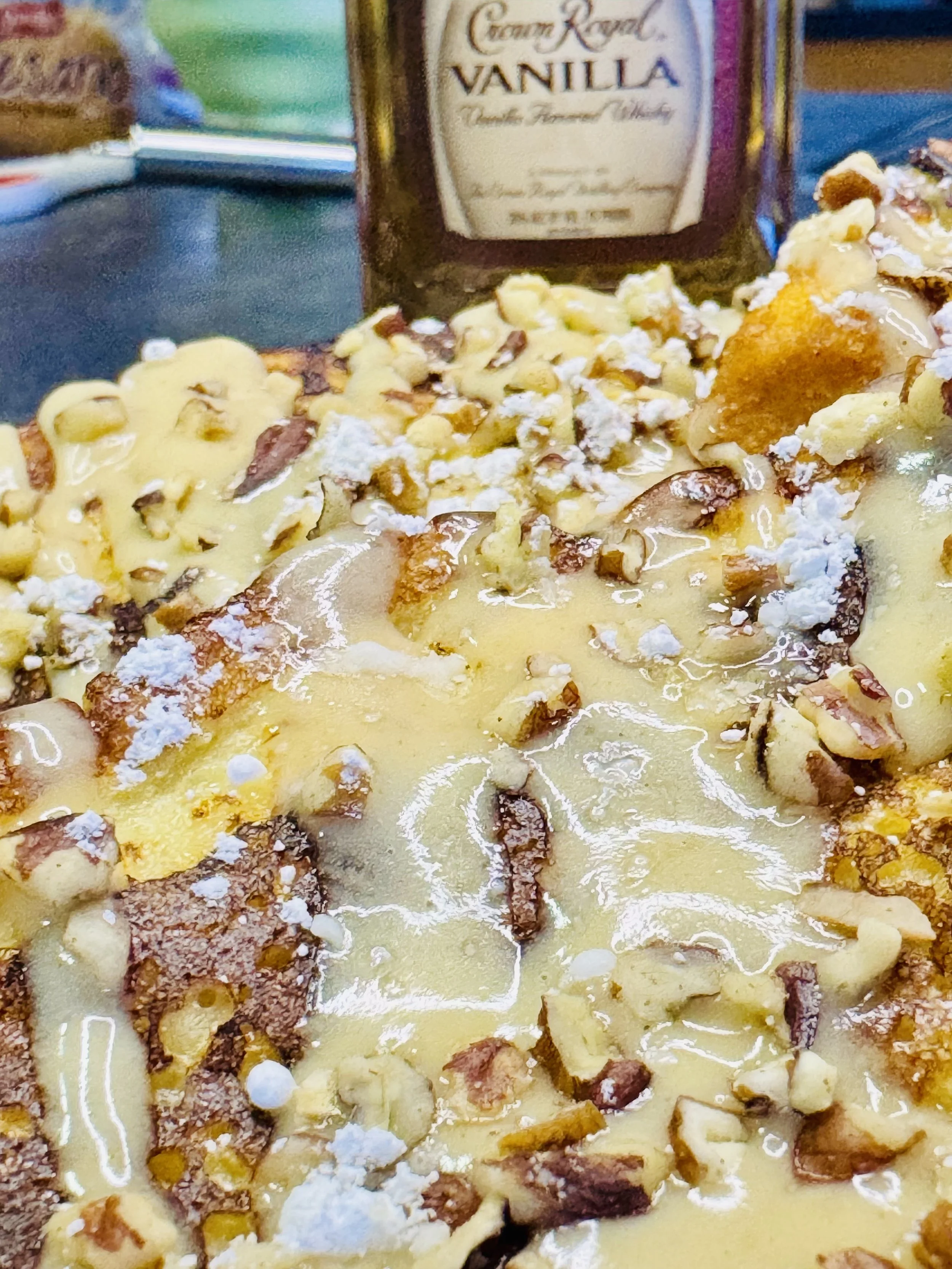 Golden eggnog French toast topped with Crown Royal cream cheese spread and crunchy pecans for a rich, festive breakfast treat