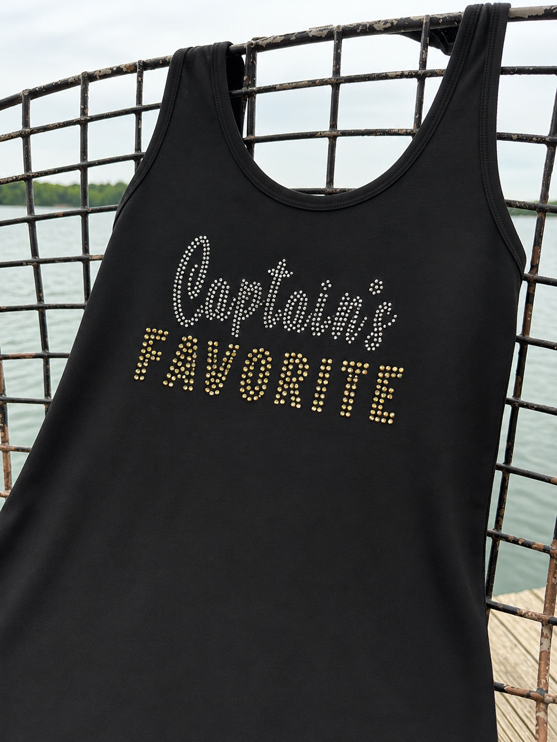 Black racerback tank top featuring silver and gold rhinestone lettering that reads "Captain's Favorite