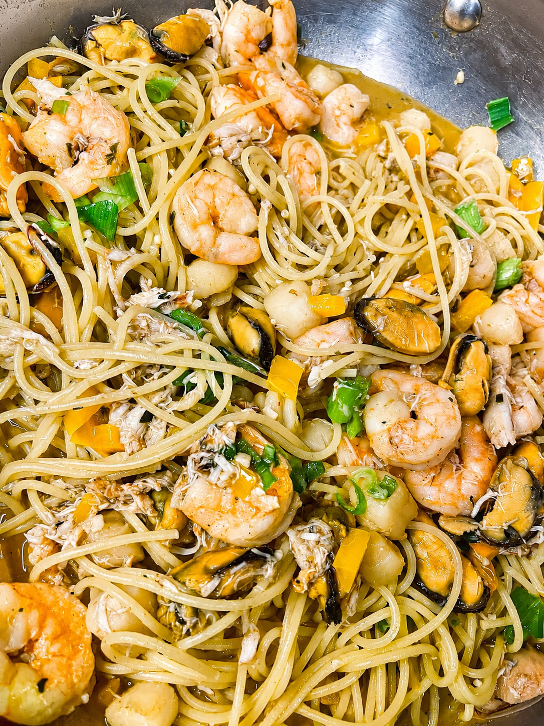 Seafood pasta with shrimp, scallops. mussels and  crab in a garlic butter white wine sauce