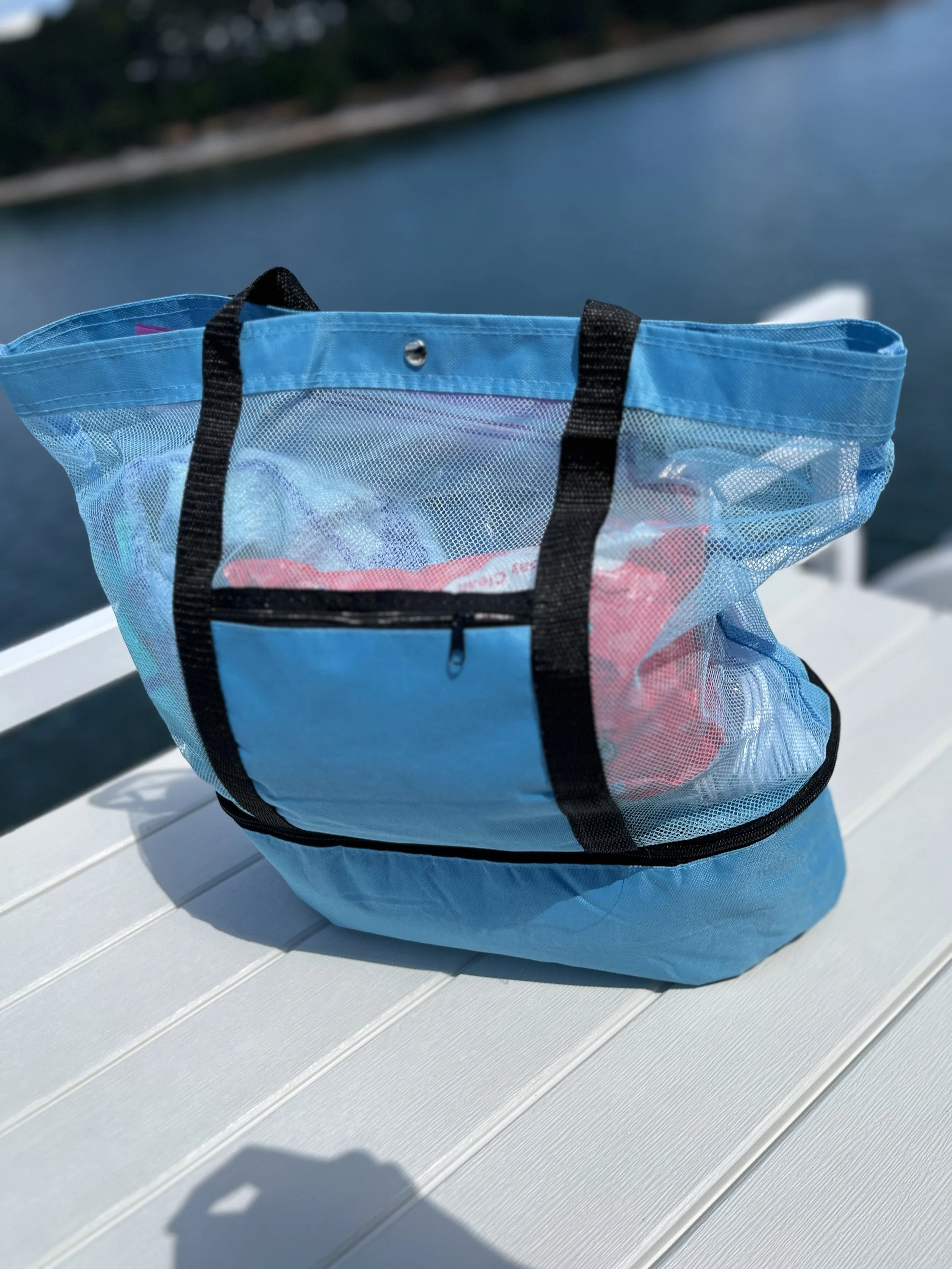 Blue mesh beach tote bag with separate bottom food compartment for snacks and drinks, ideal for lake trips, boating, beach days, and travel.