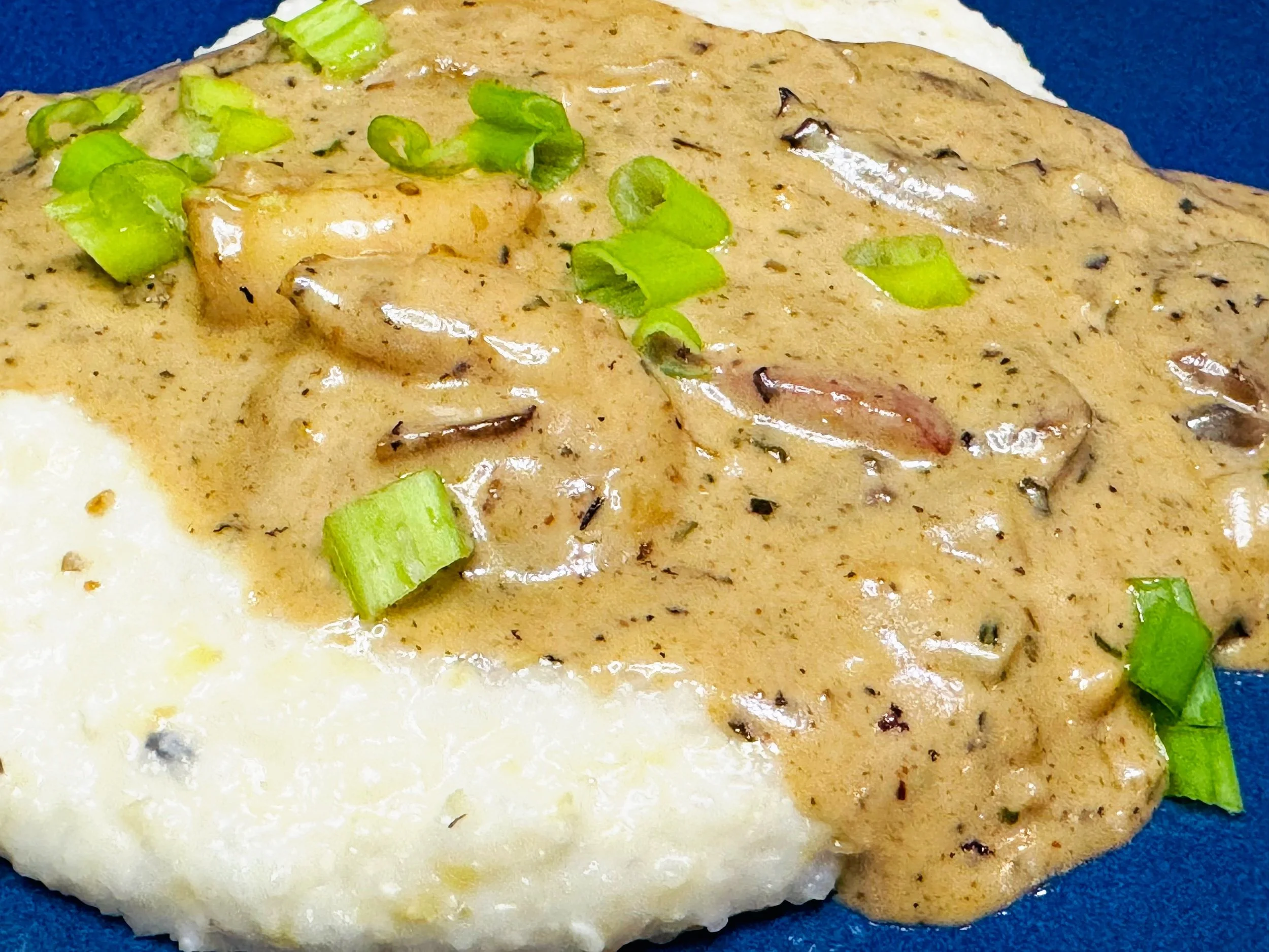 Creamy shrimp and sausage gravy served over buttery Southern grits