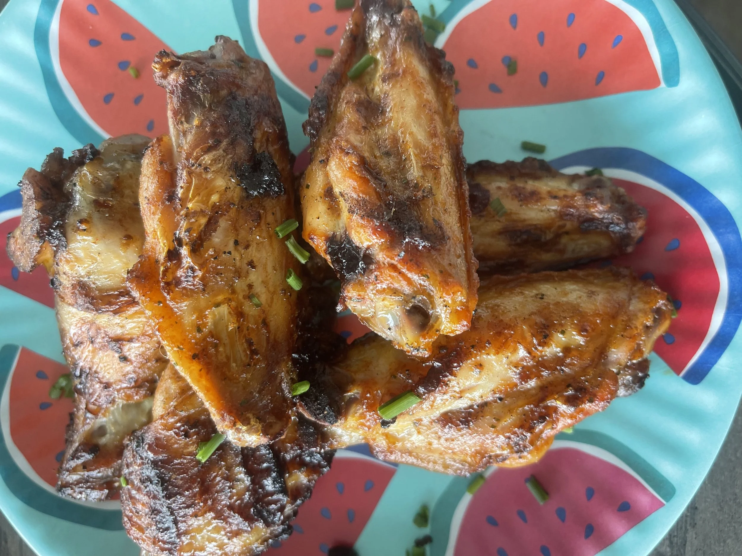 Grilled chicken drumettes with smoky seasoning and flavorful sauces
