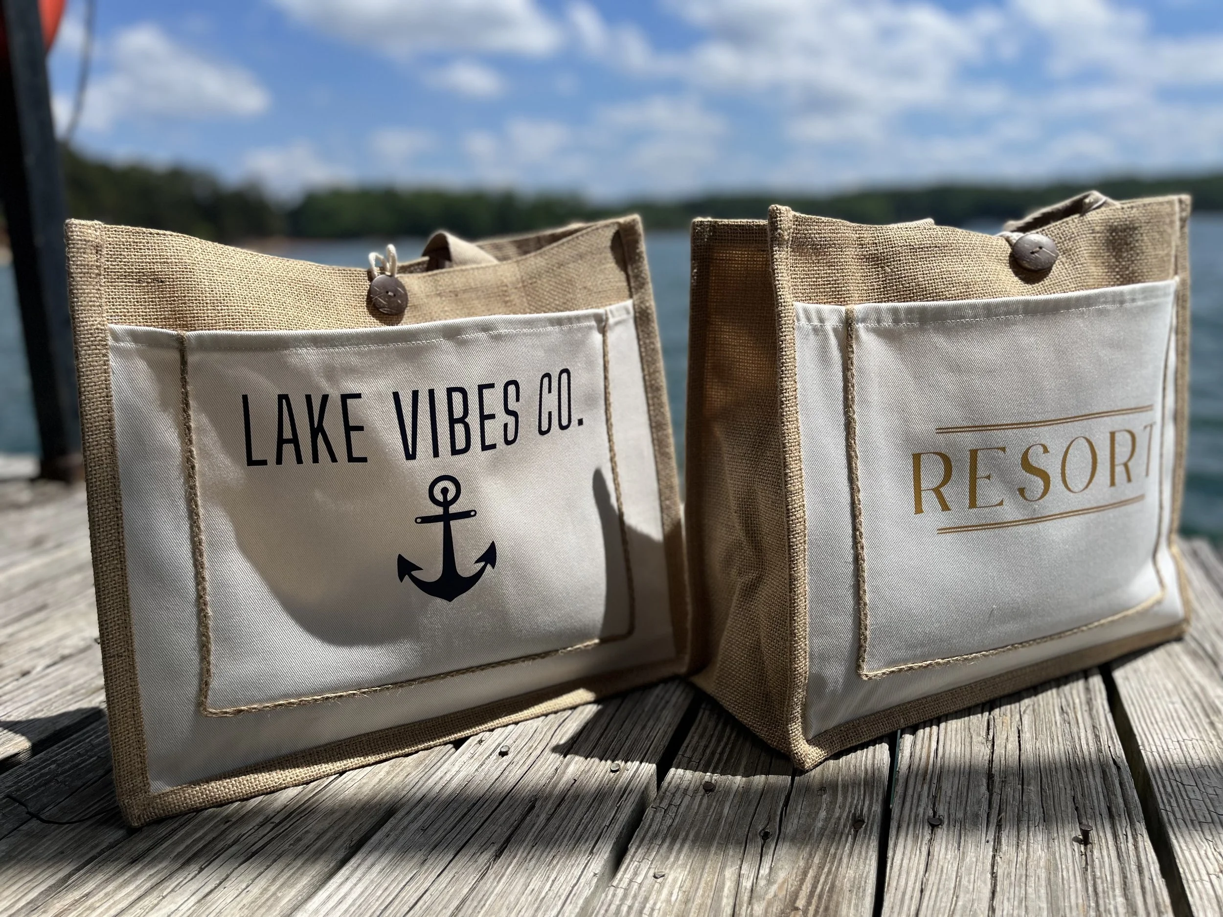 Natural woven jute tote bag collection featuring coastal and resort-inspired designs, perfect for lake life, beach vacations, boating, shopping, and travel.