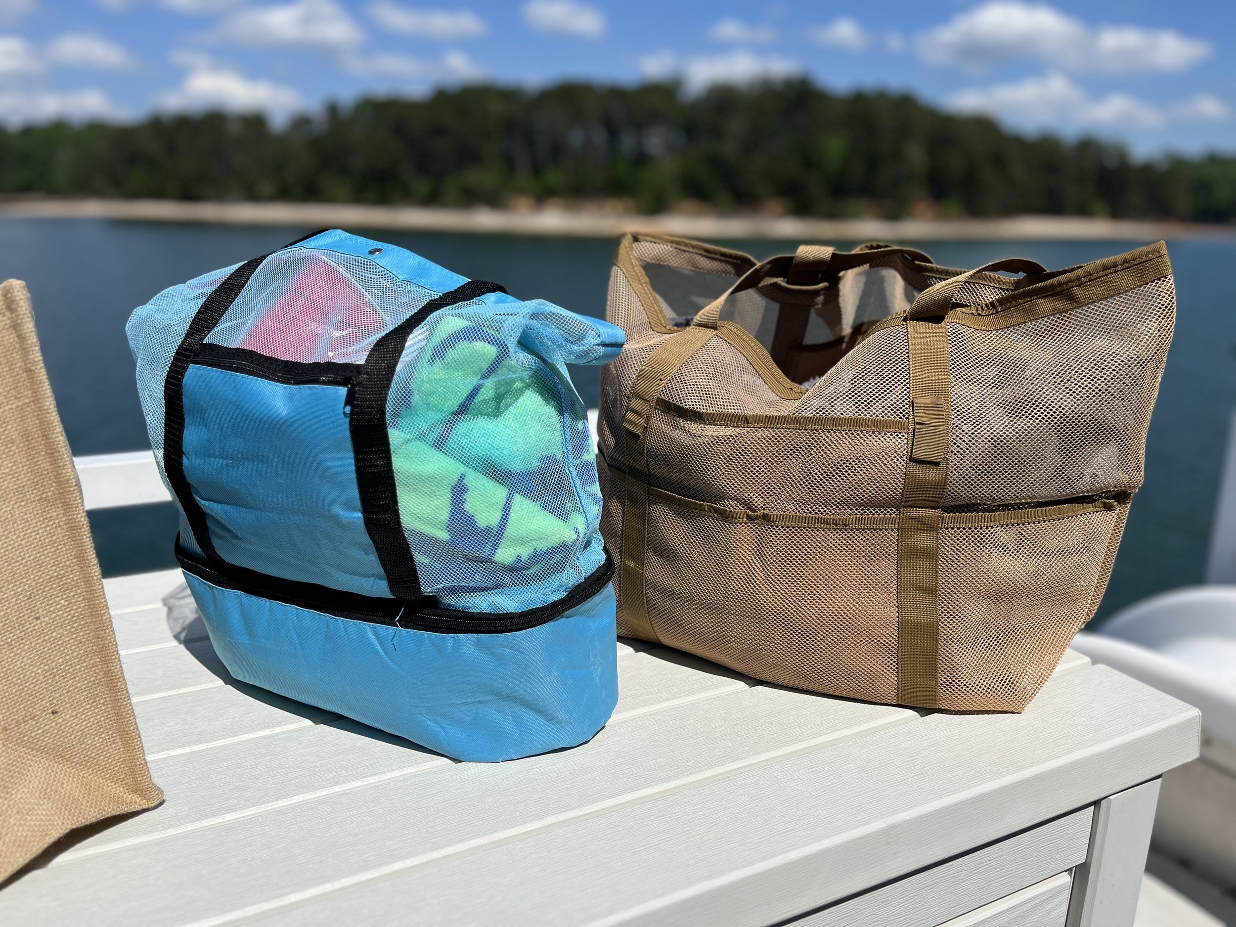 Blue mesh beach tote bag with separate bottom food compartment for snacks and drinks, ideal for lake trips, boating, beach days, and travel.