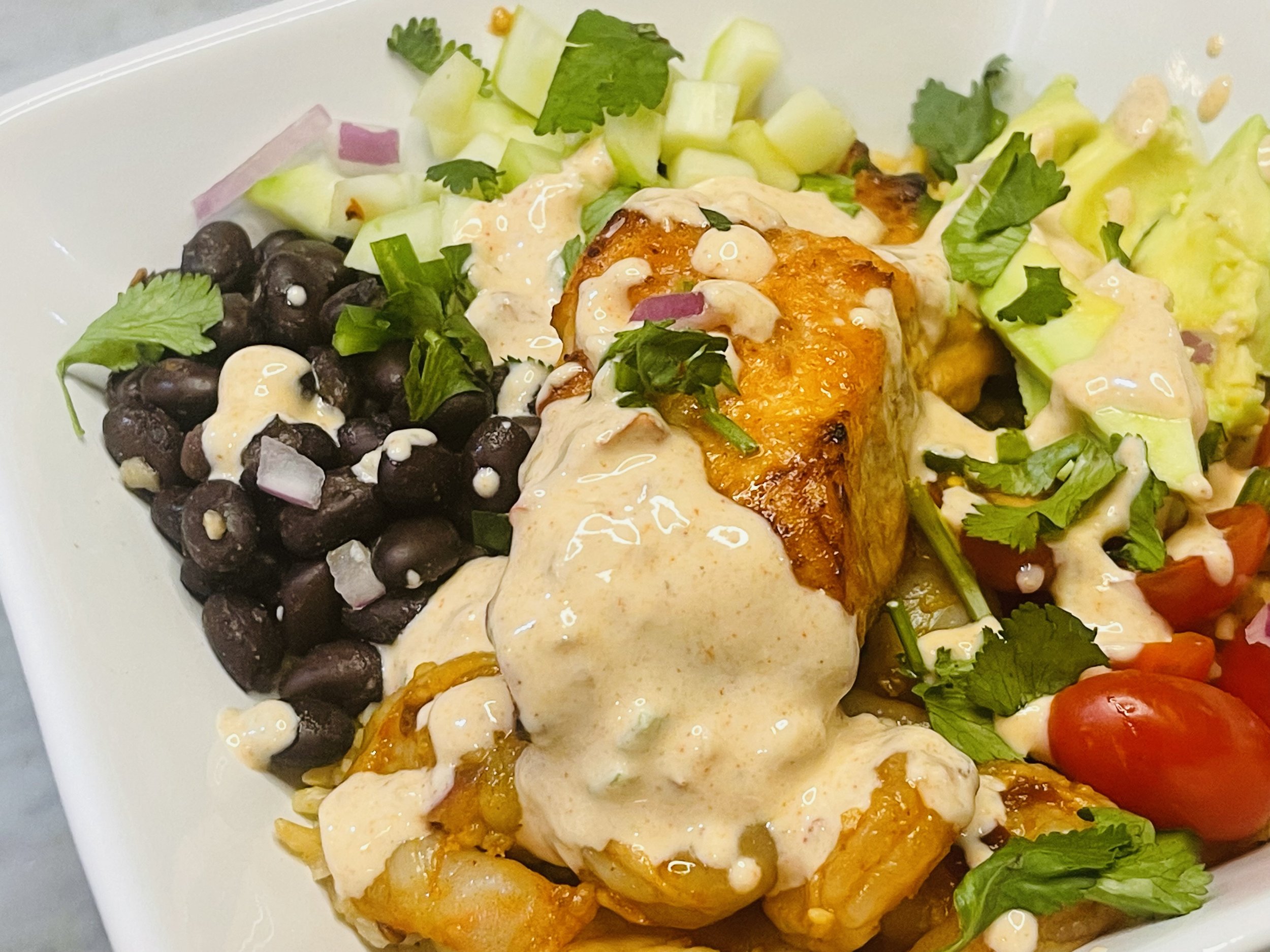 Sautéed salmon and shrimp are glazed in a honey chipotle sauce
