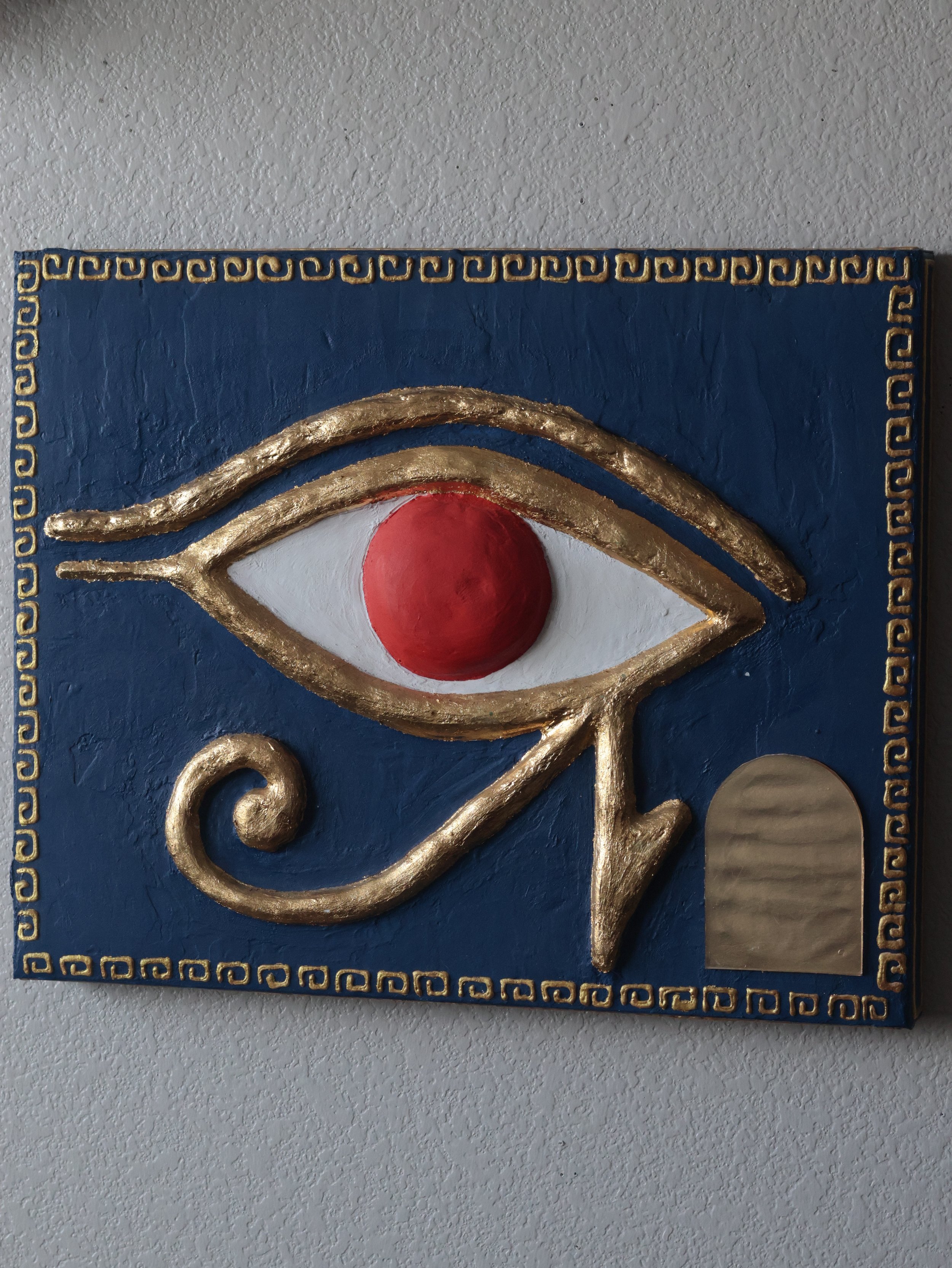 Front view of an Egyptian spiritual symbol painting of the Eye of Ra.