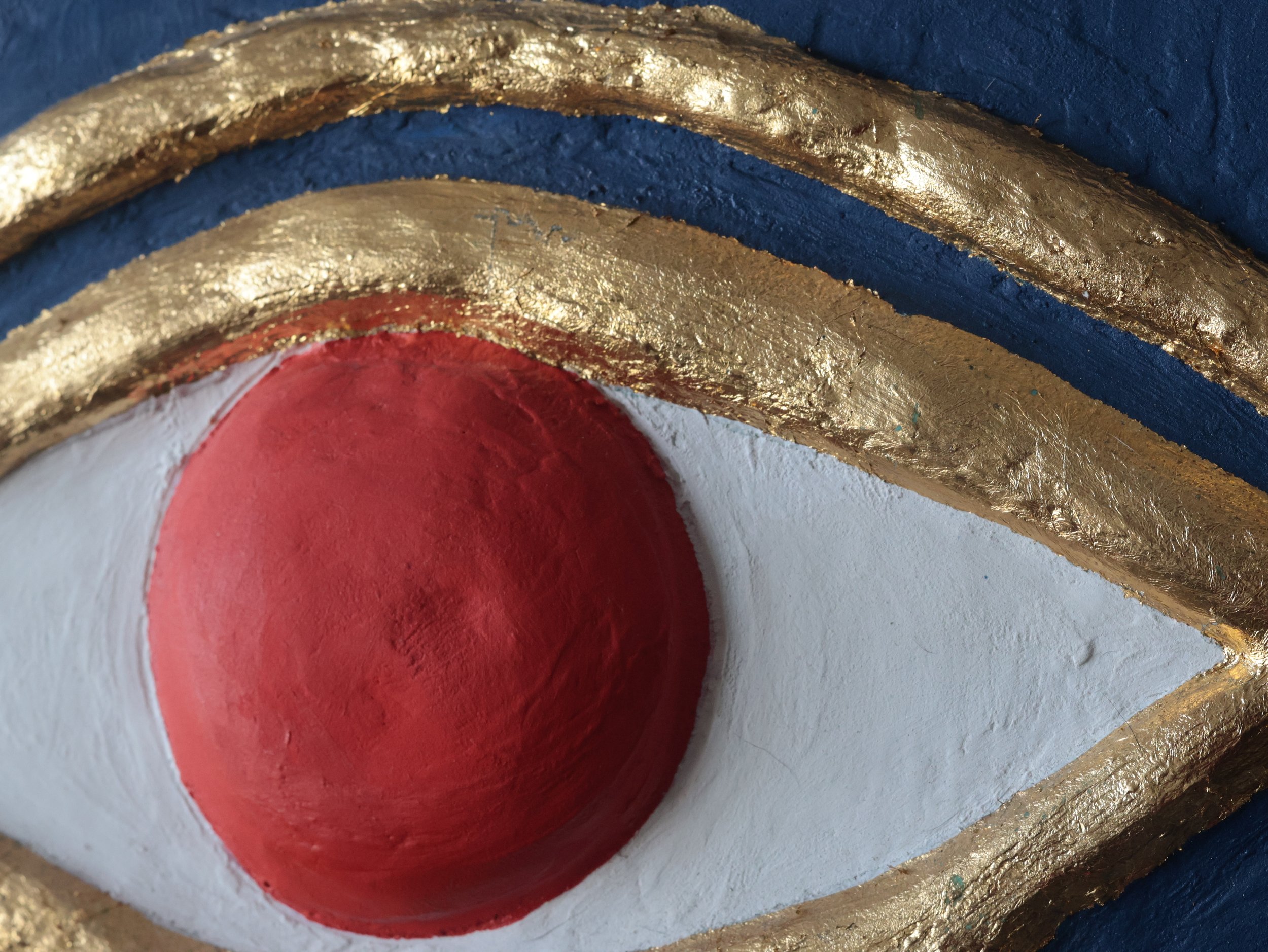 Close up, detailed image, front a different angle, of an Eye of Ra Egyptian inspired artwork.