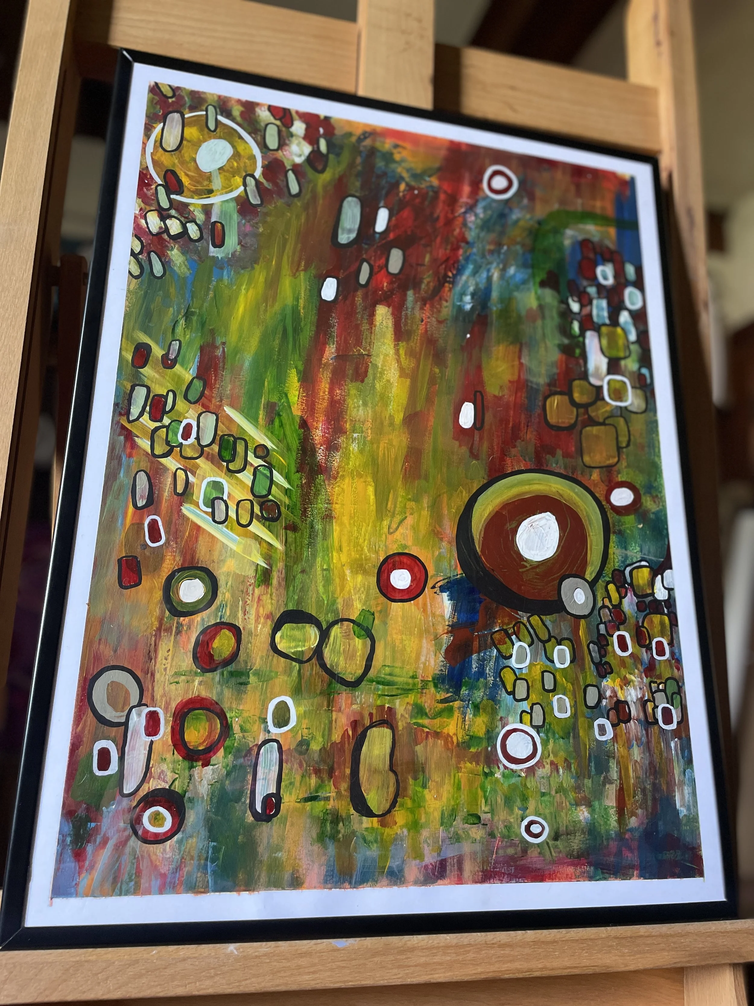 Photo of a hand-painted, original abstract painting sitting on an easel in artist Shay Holloway's studio in Northwest Arkansas. This painting is sitting framed on an easel.