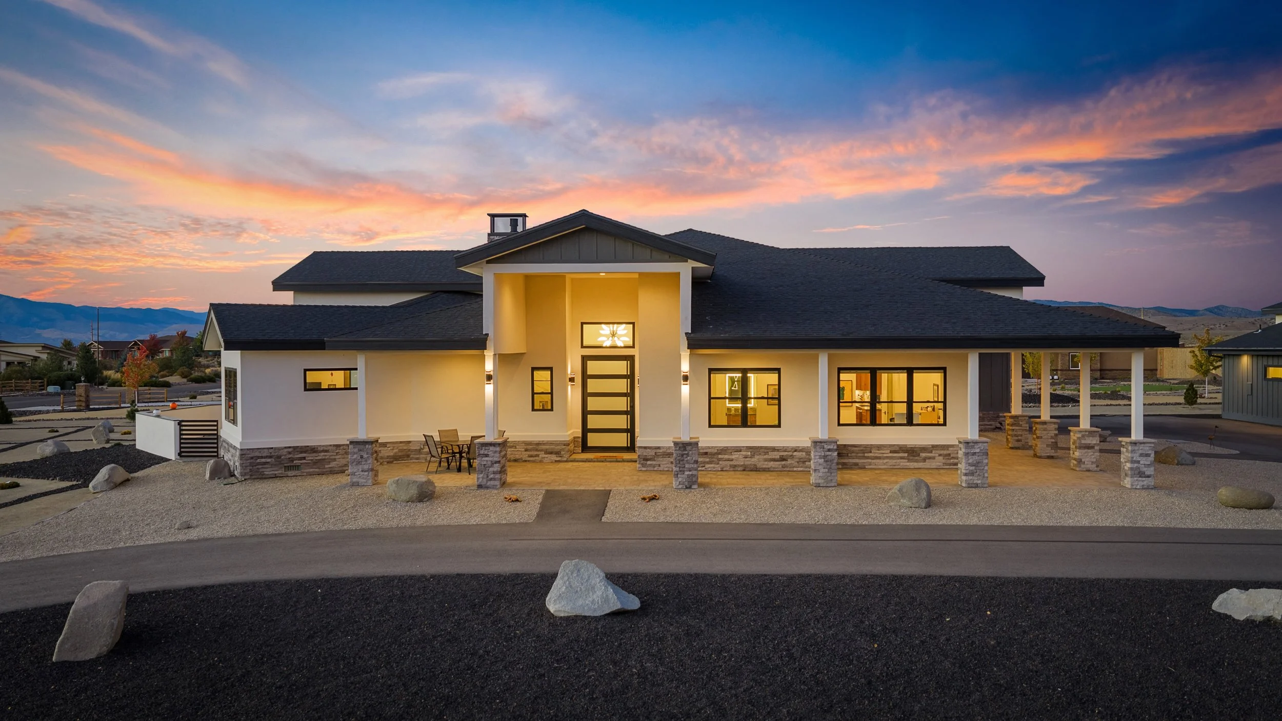 Aerial twilight view of a single-story home and shop in Minden