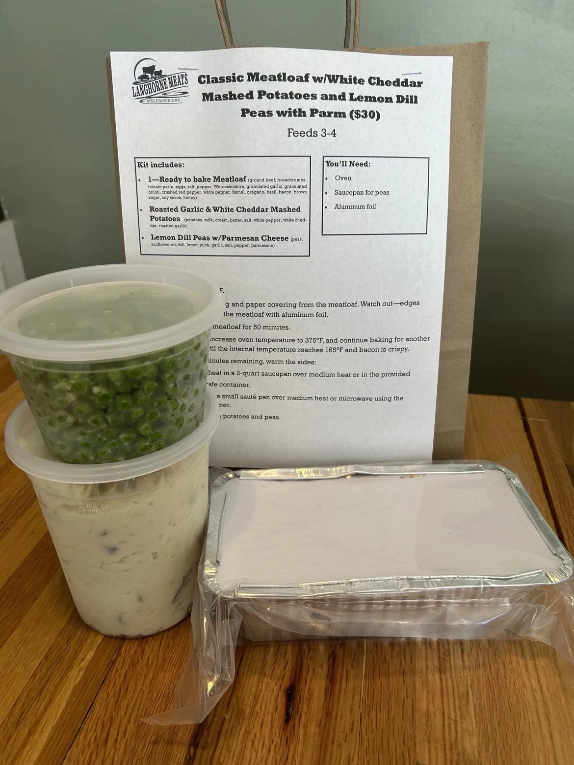 All Beef Meatloaf:
Flavorful beef meatloaf with brown sugar glaze and heritage pork bacon. Served with Roasted Garlic & White Cheddar Mashed Potatoes and Peas with Garlic Dill Butter. Ready in just over an hour.
