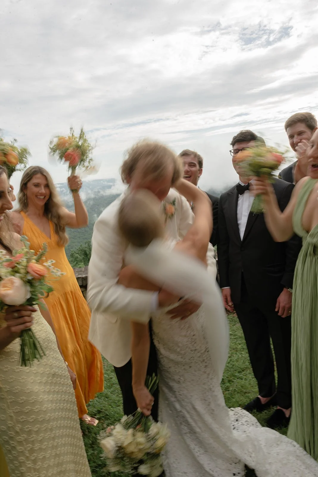 Sewanee Wedding on a Bluff; happy bride and groom; elated wedding party; fresh spring colors