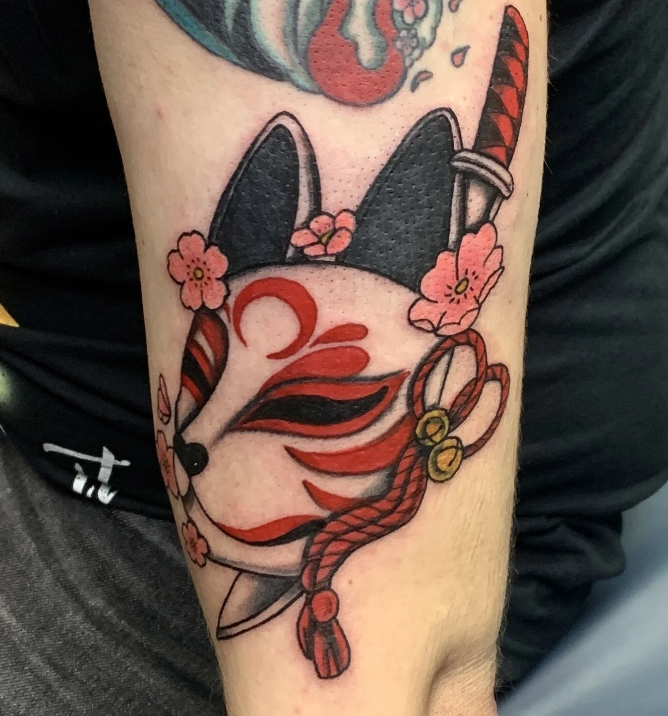 Japanese Kitsune mask tattoo done in color.