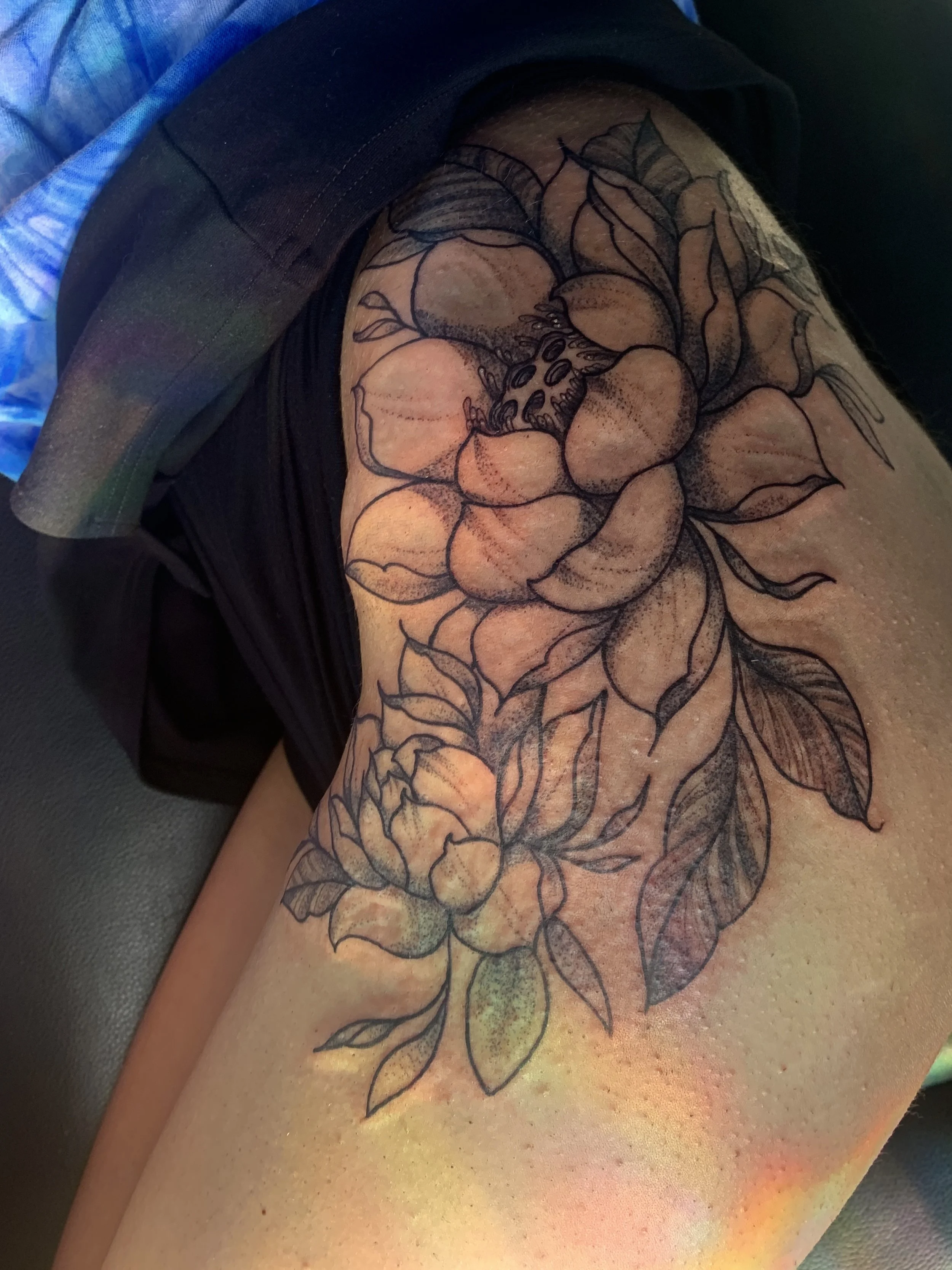 Lotus floral hip tattoo