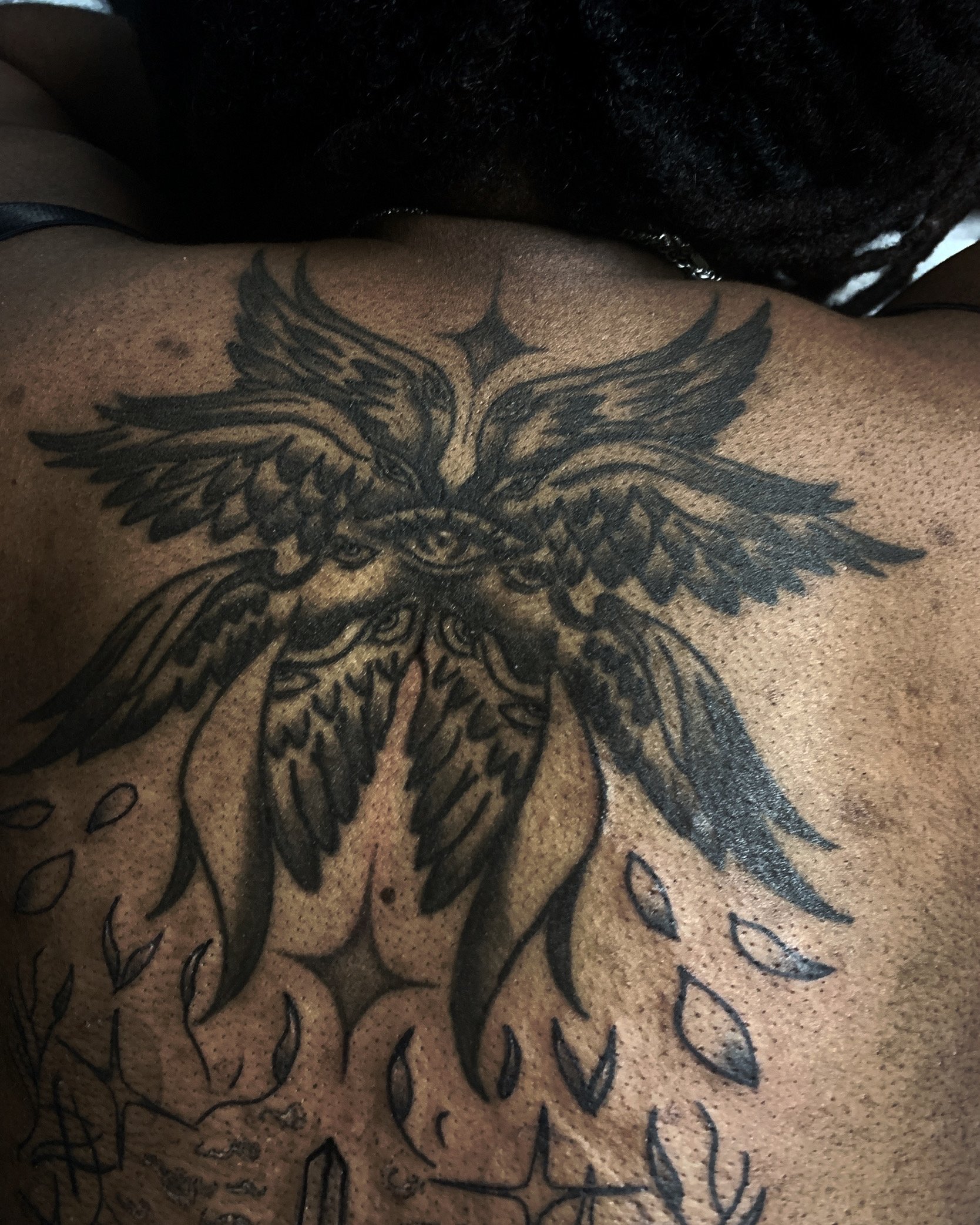 Seraphim back tattoo done in black and grey.